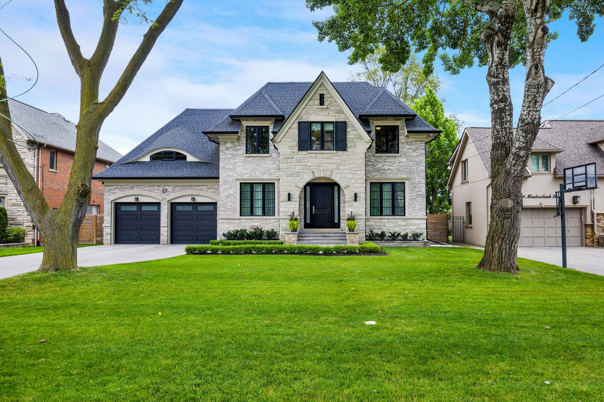 A tree-lined residential street in central Etobicoke