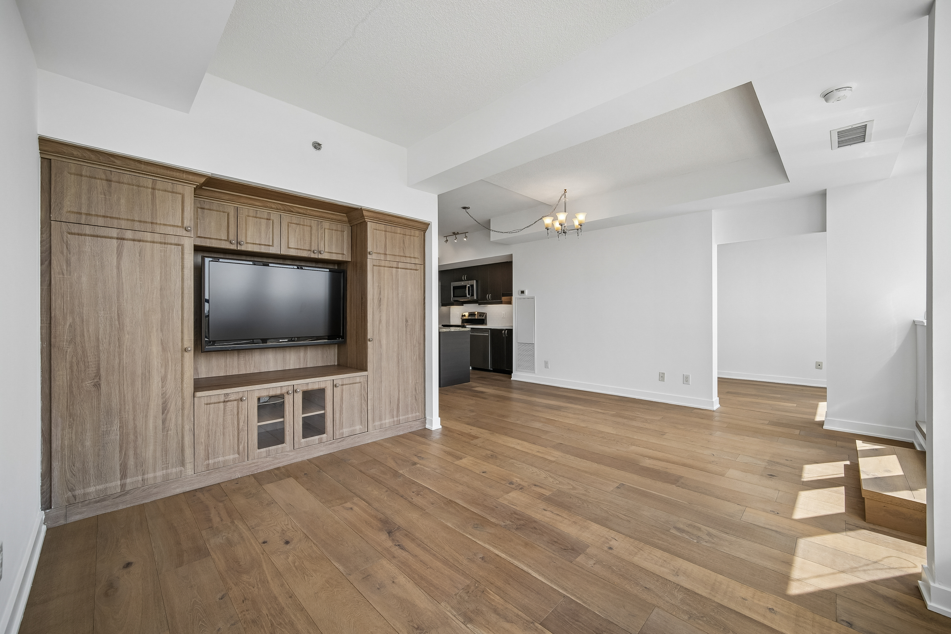 Wide-plank engineered flooring throughout