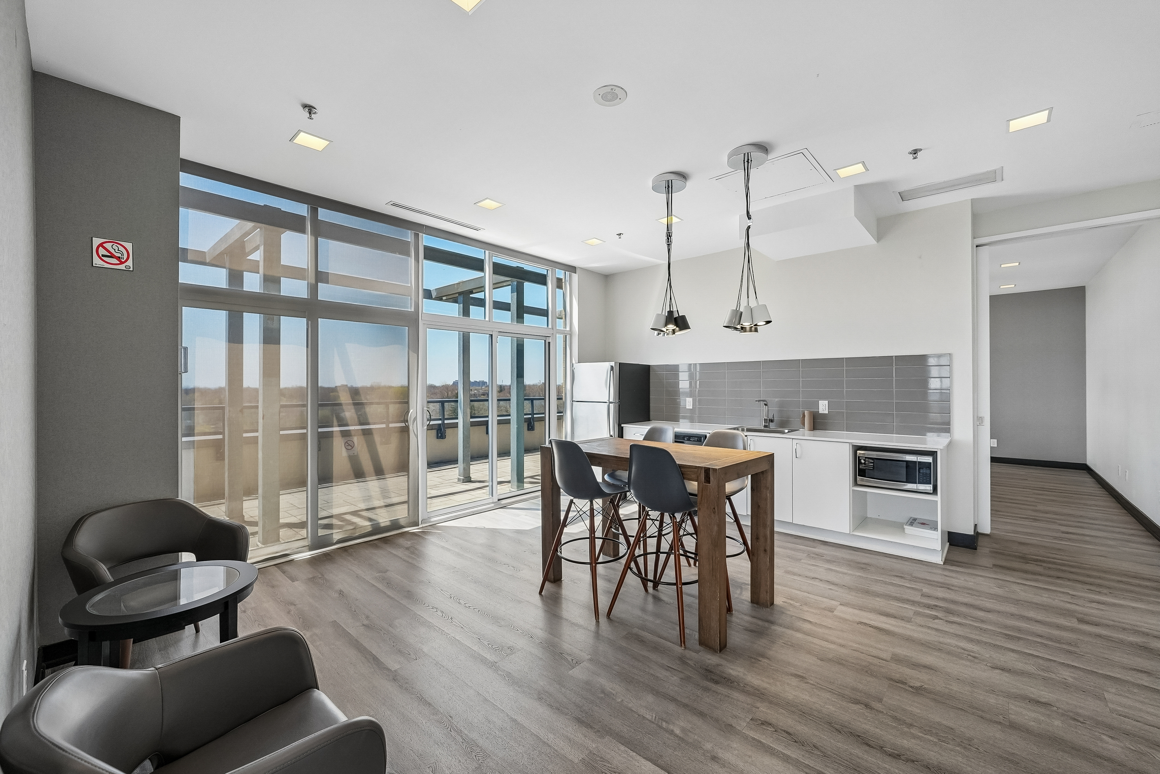 Rooftop lounge with floor-to-ceiling lake views