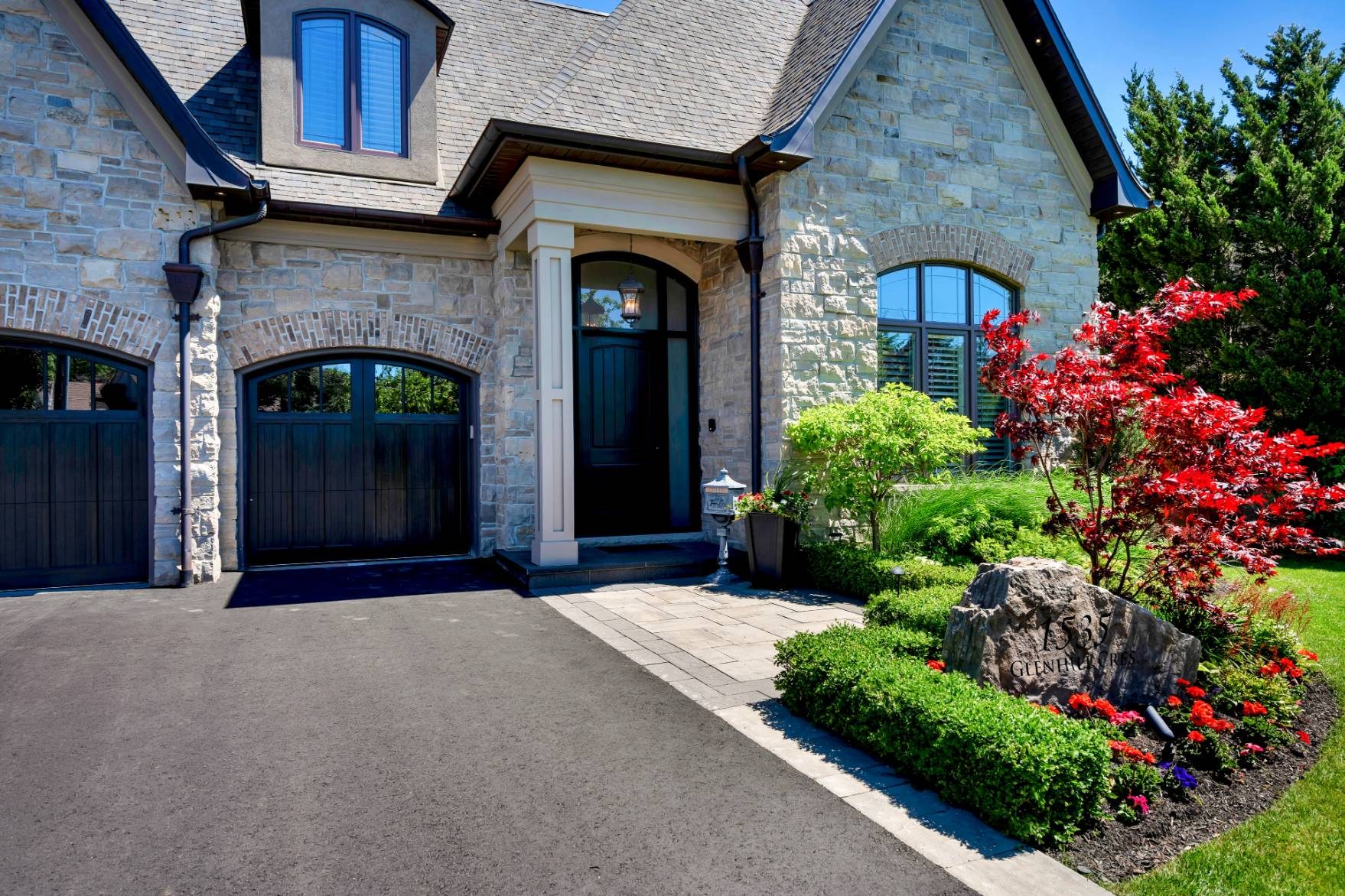 Manicured gardens and front entrance