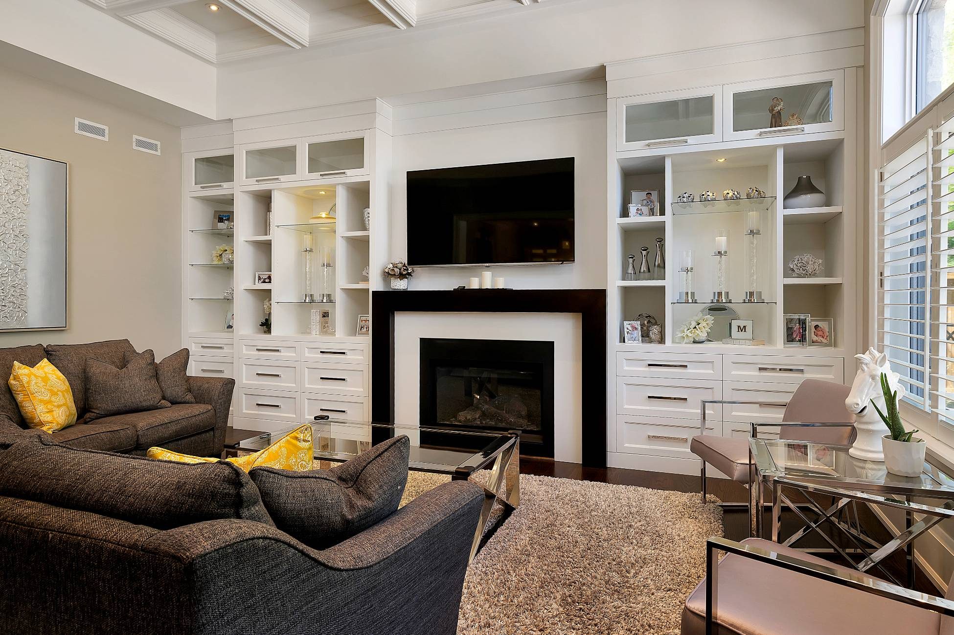Living room with gas fireplace and custom built-ins