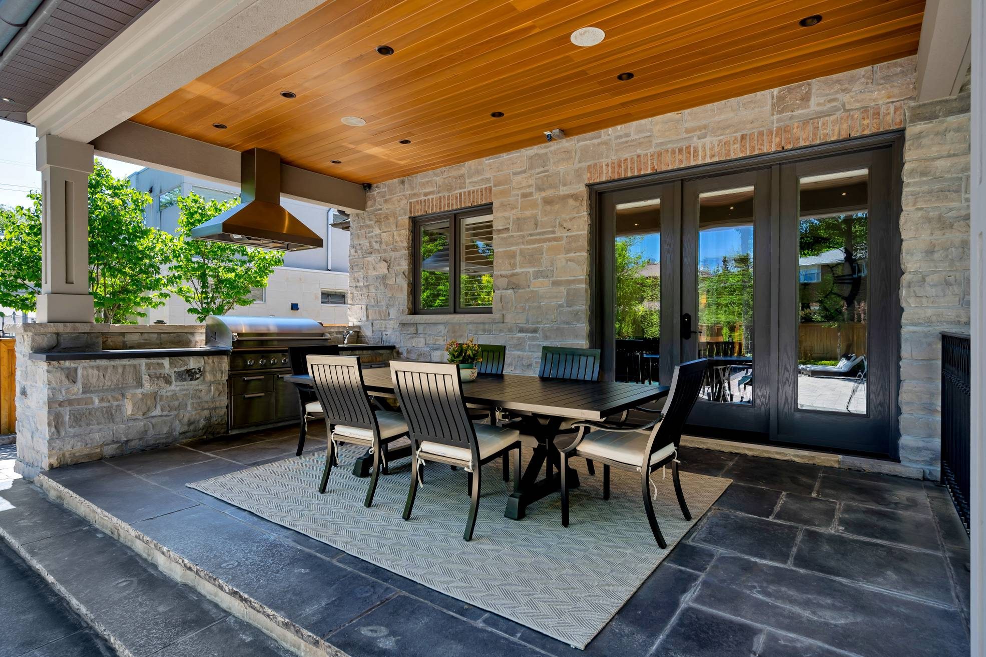 Covered outdoor kitchen and dining area