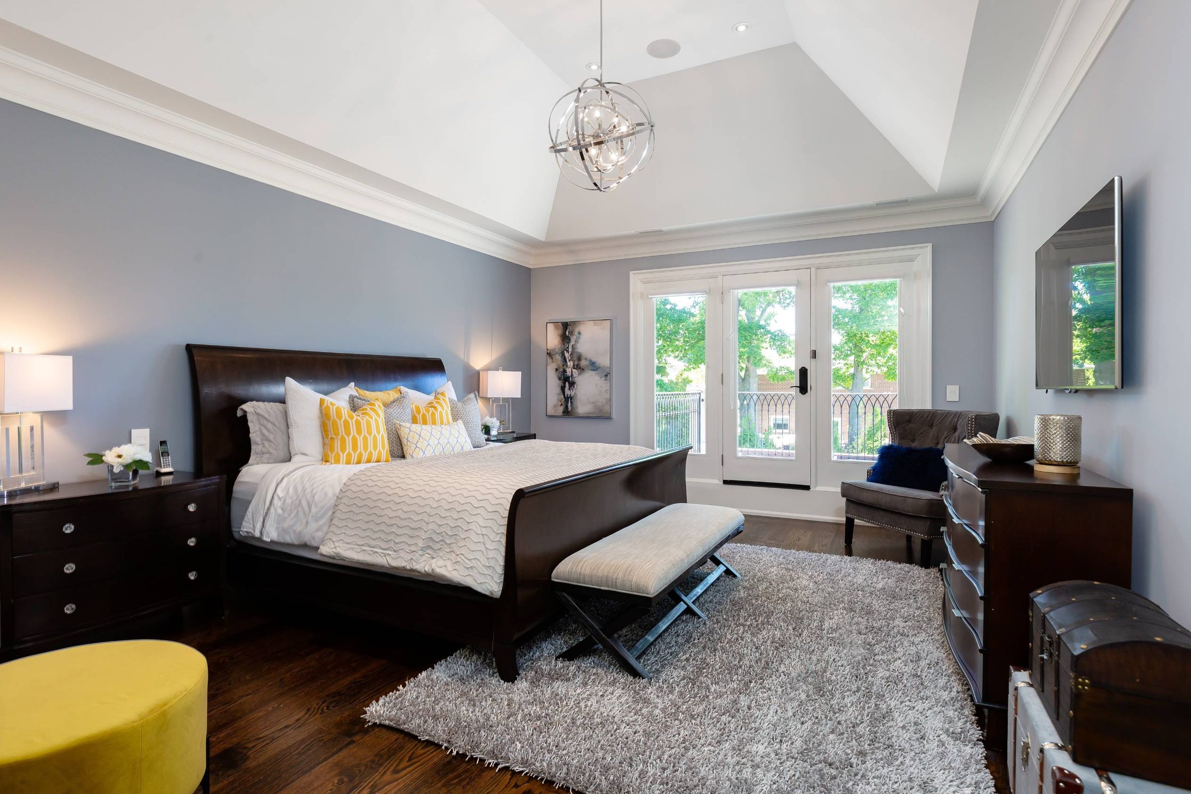 Primary suite with vaulted ceilings and walk-out