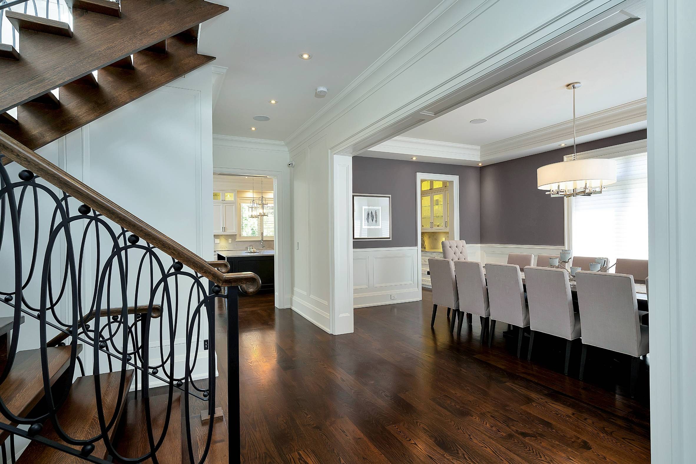Living room with coffered ceilings, gas fireplace and arched windows