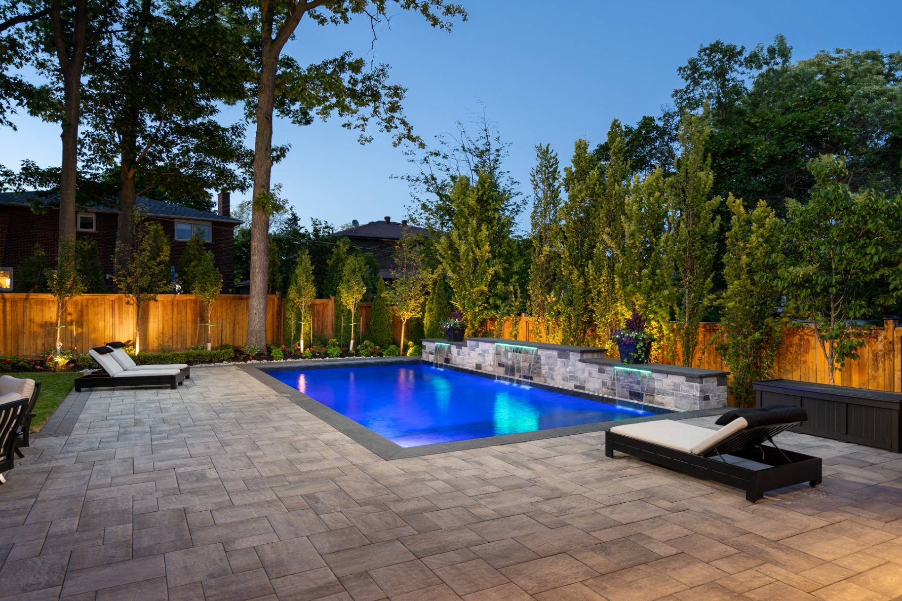 Salt-water pool and gardens illuminated at twilight