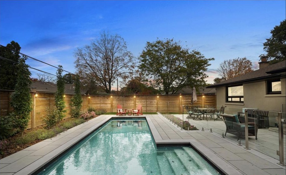The heated inground pool and terrace at 16 Oldham Road at dusk