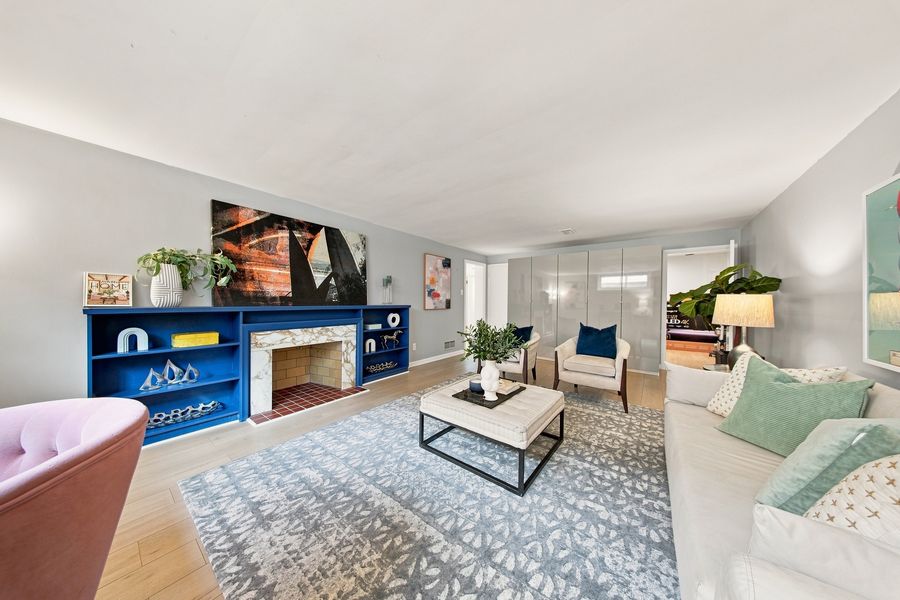 Lower-level recreation room with fireplace and built-ins — 16 Oldham Road