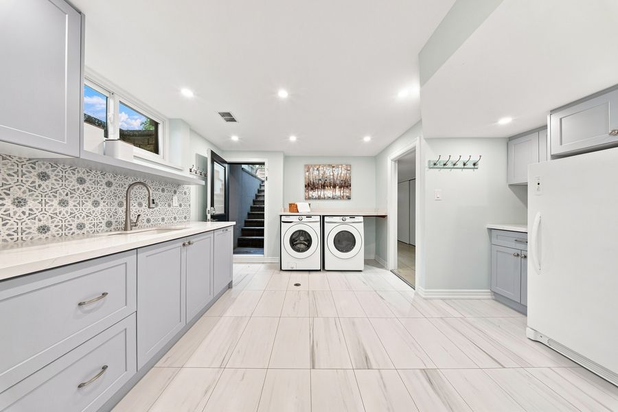 Lower-level kitchenette and large laundry room — 16 Oldham Road