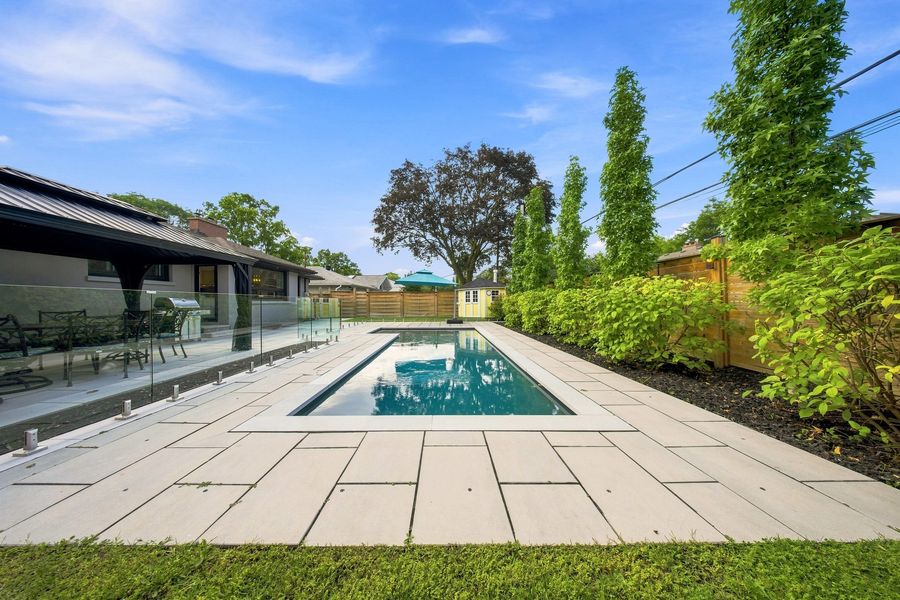 The pool terrace with the house beyond — 16 Oldham Road