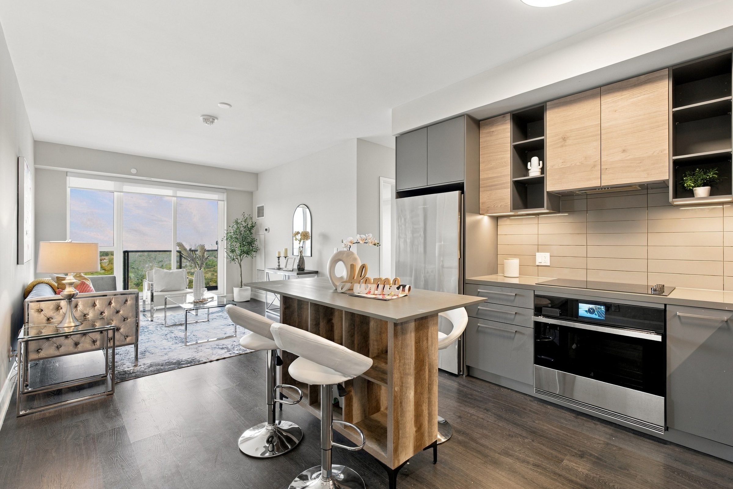 Open-concept kitchen and living room at Suite 1902, 38 Gandhi Lane, Markham