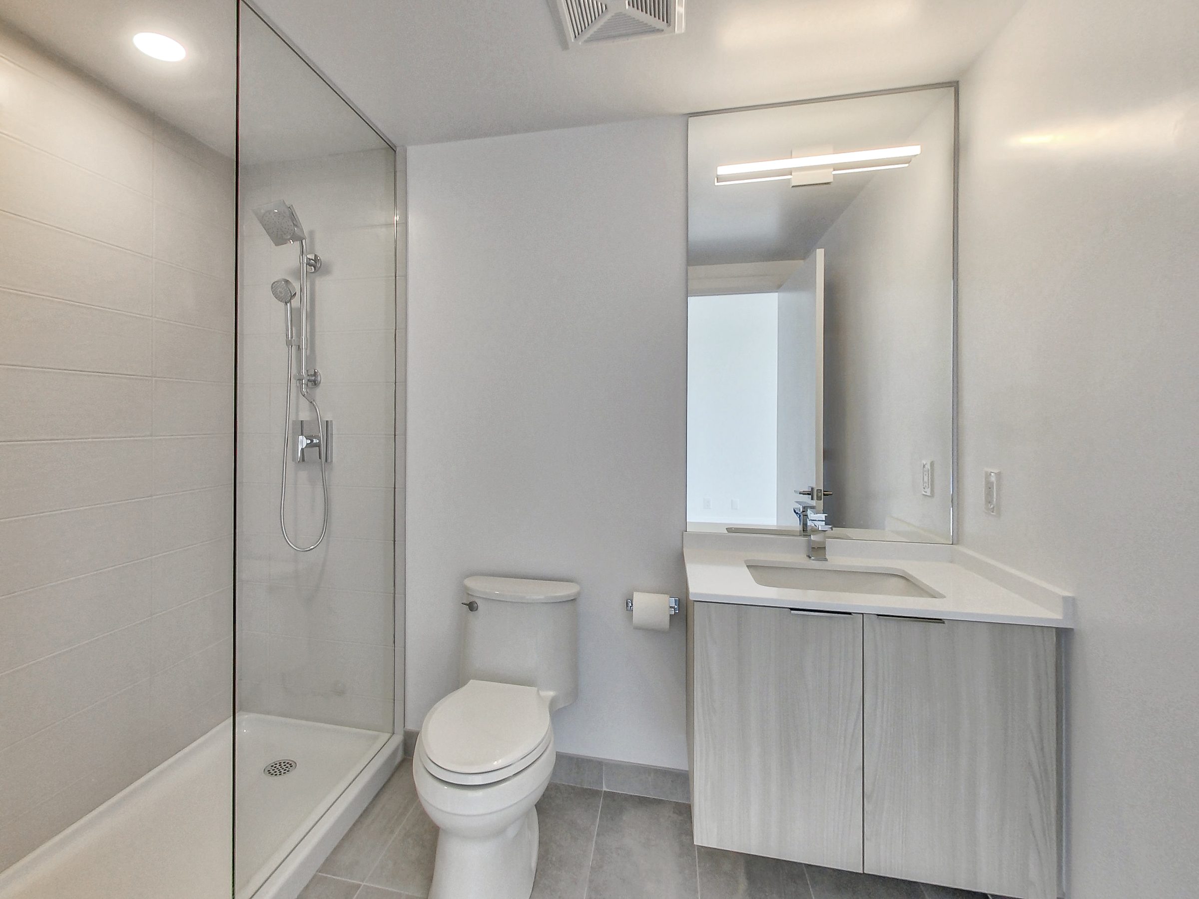 The ensuite with a frameless glass shower