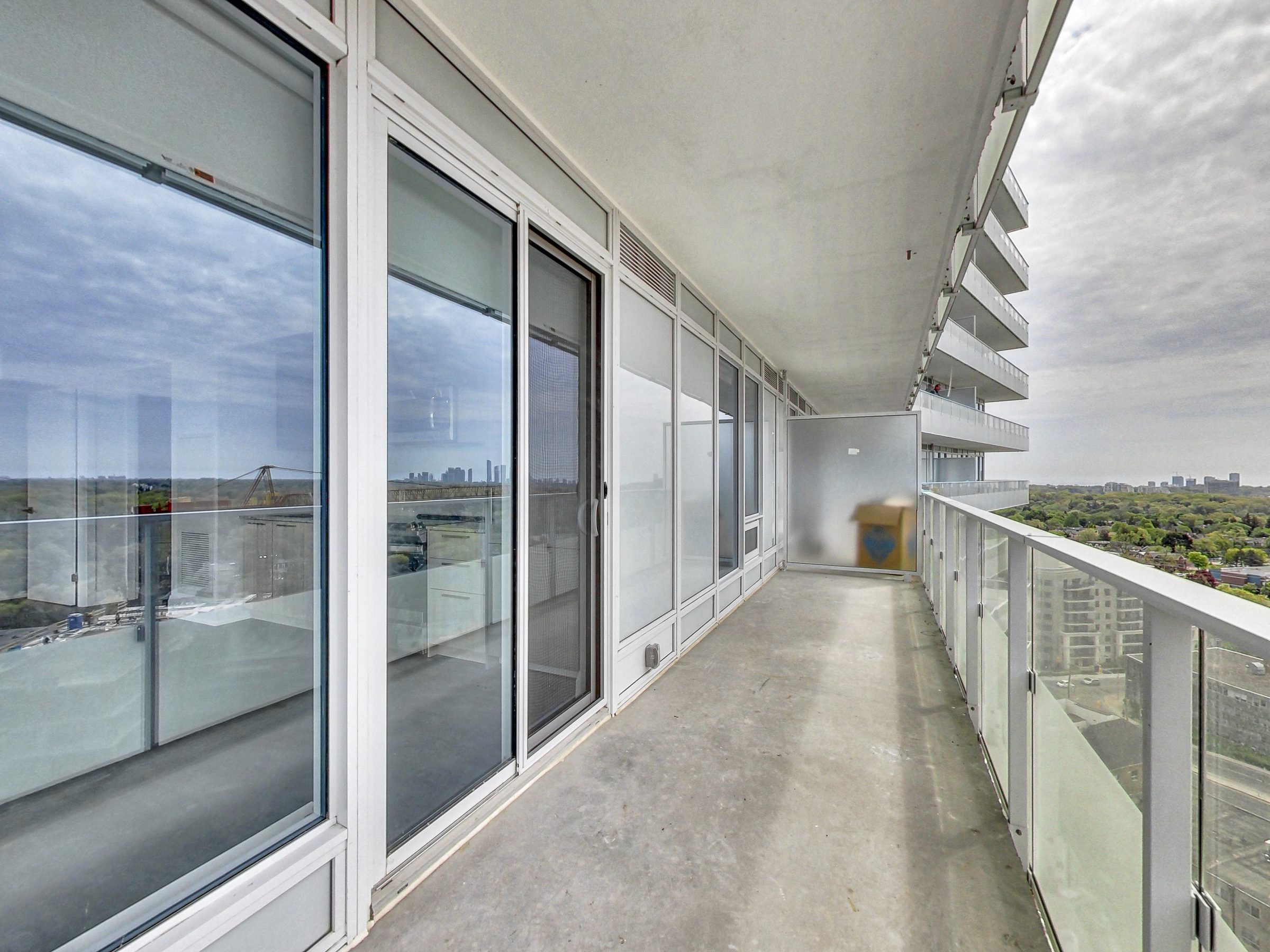 Private outdoor space with frameless glass railings