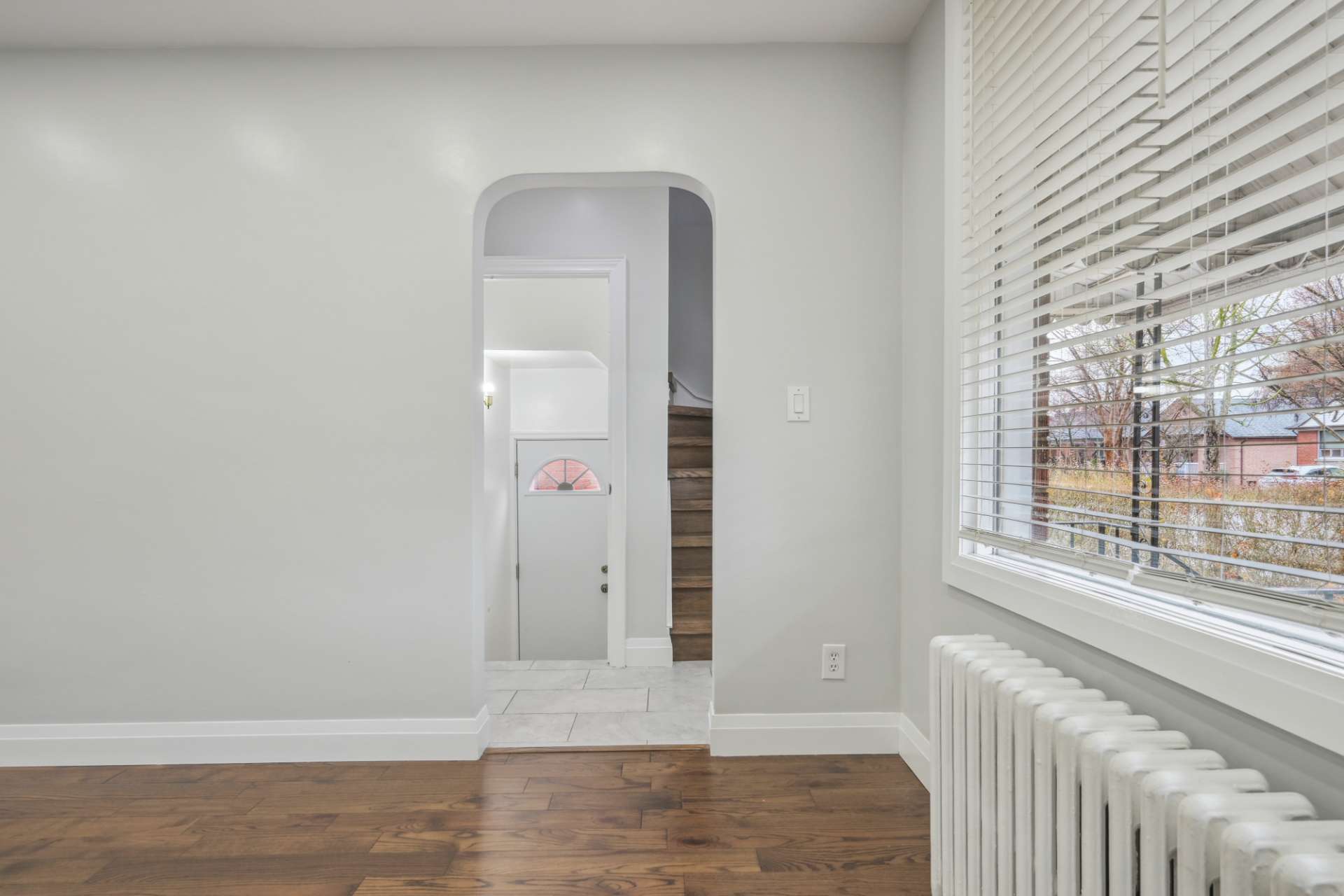 Dining area framed by an arched passage