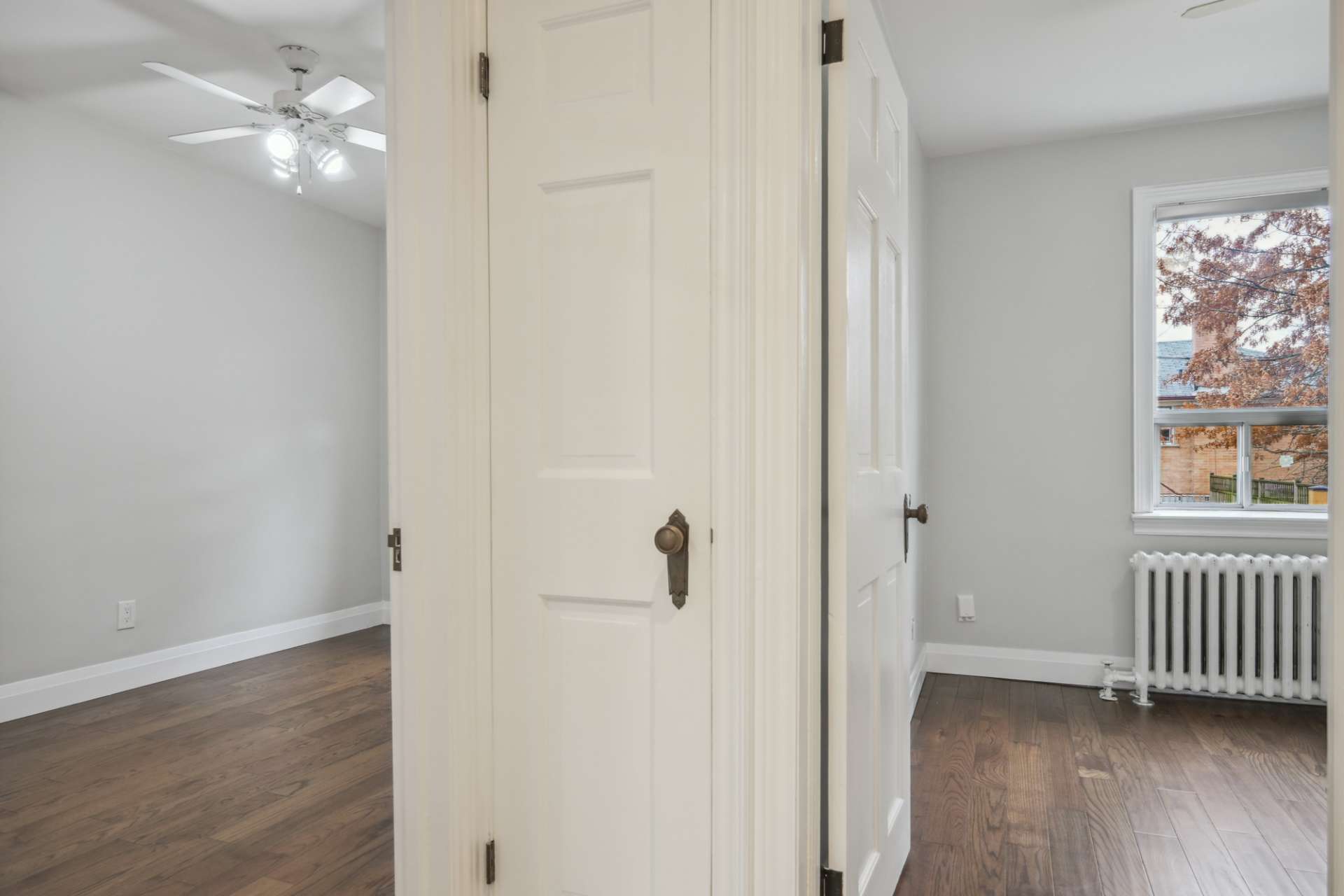 Bright bedroom with closet and large window