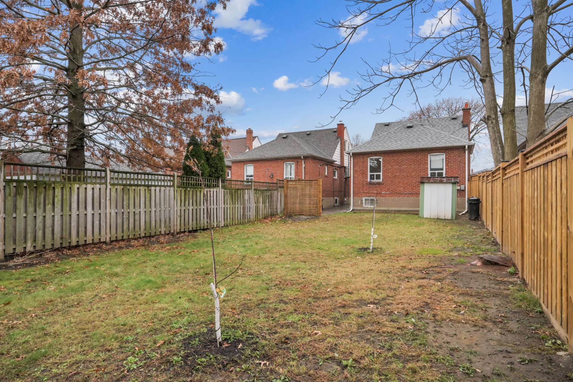 Deep, fully fenced backyard