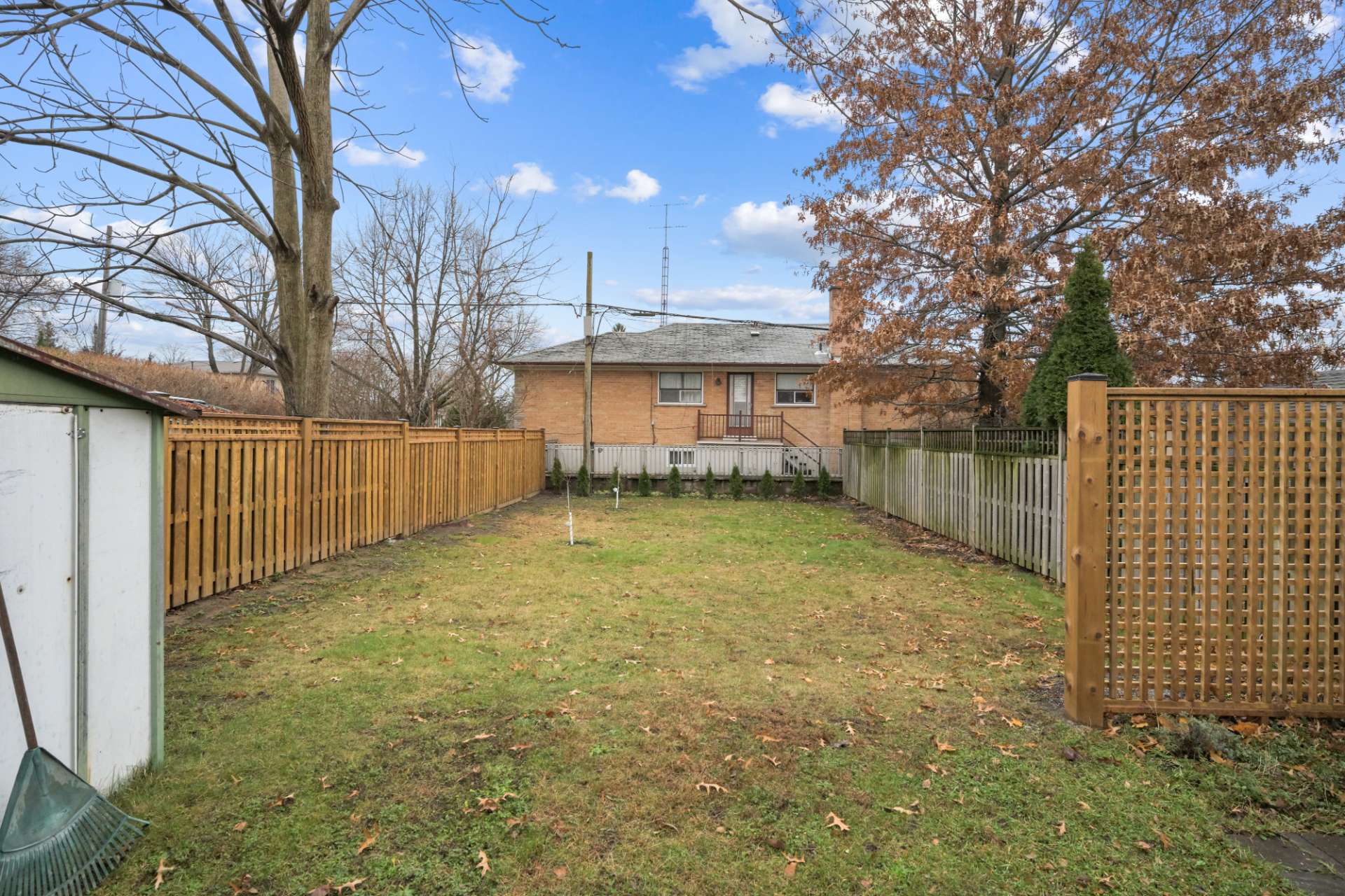 Fully fenced backyard with garden shed