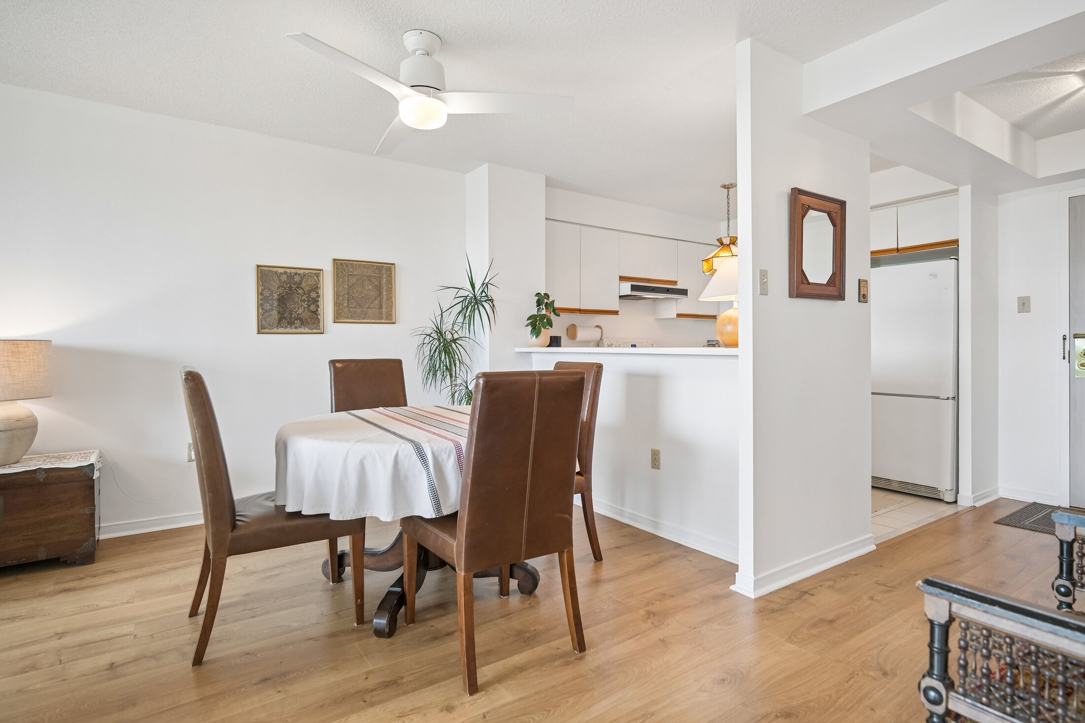 Bright open living room with treetop views — Suite 1211