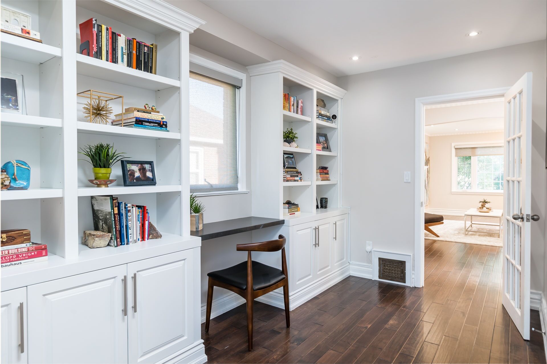 Library and den with custom built-in millwork and workstation