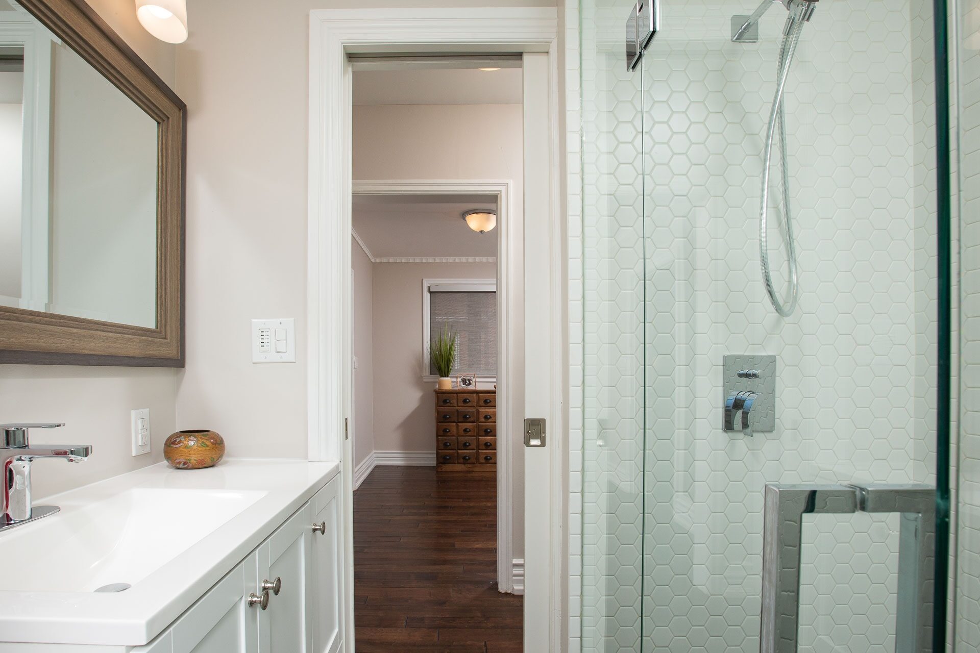 Spa-inspired main-floor bathroom with glass shower
