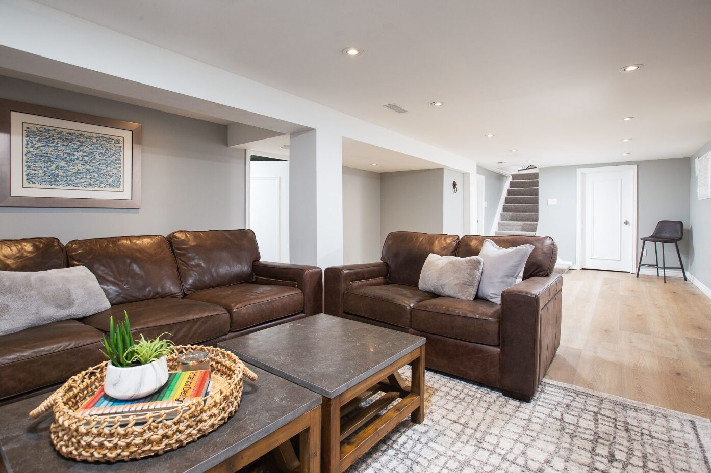 Lower-level media lounge with custom built-ins