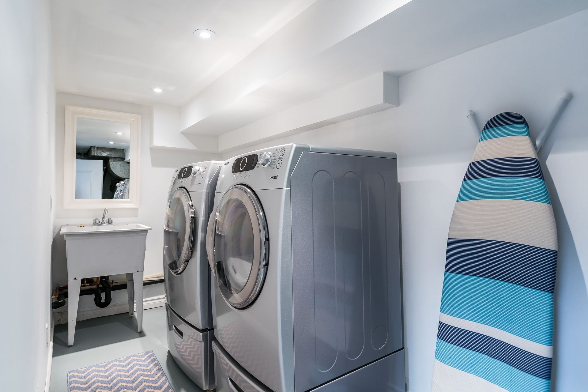 Lower-level laundry room with ample storage