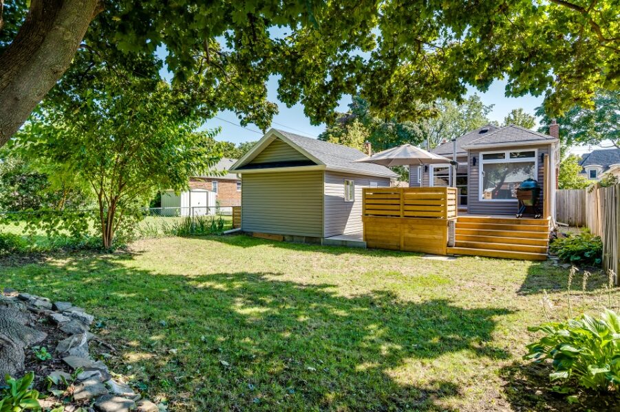 Professionally landscaped rear garden with oversized garage