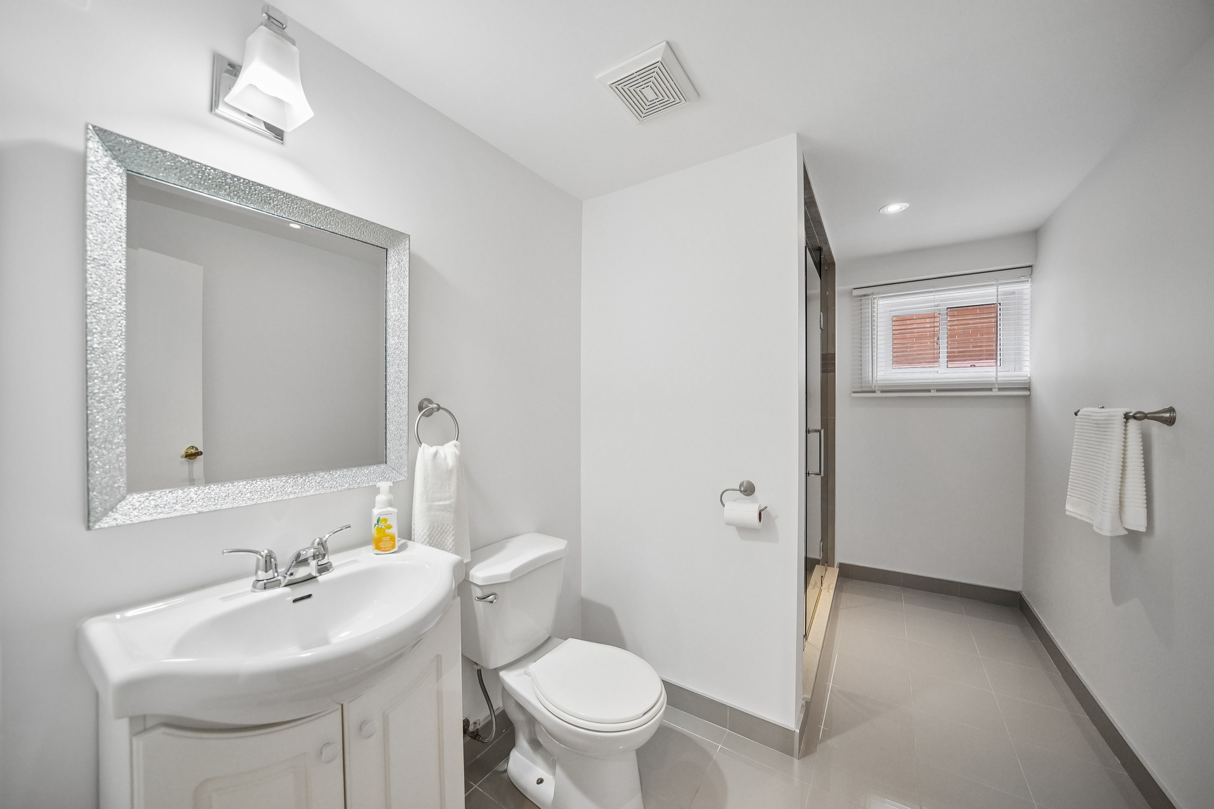 Third full bathroom — lower suite
