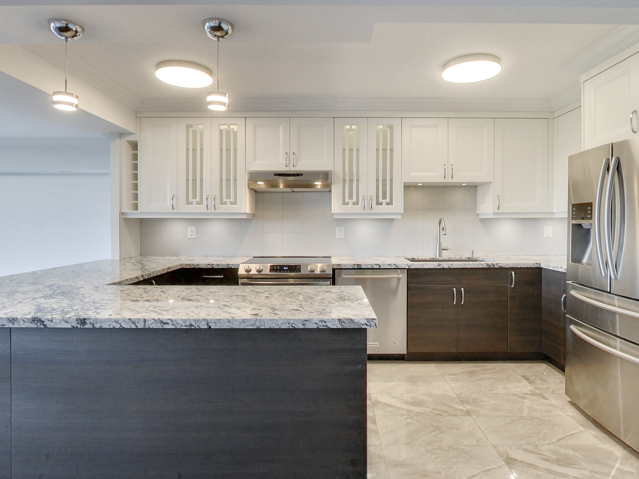 Renovated chef's kitchen with stone island