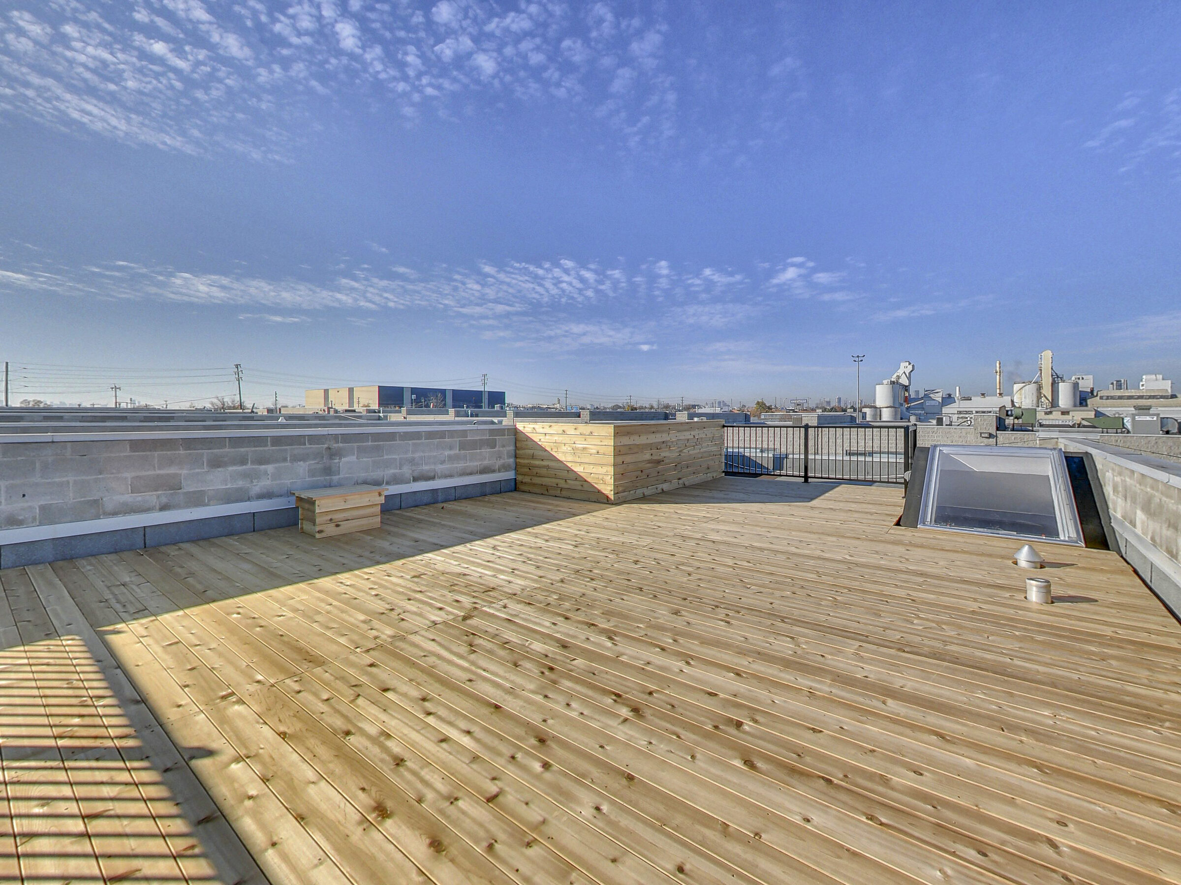 Rooftop deck with open skyline views