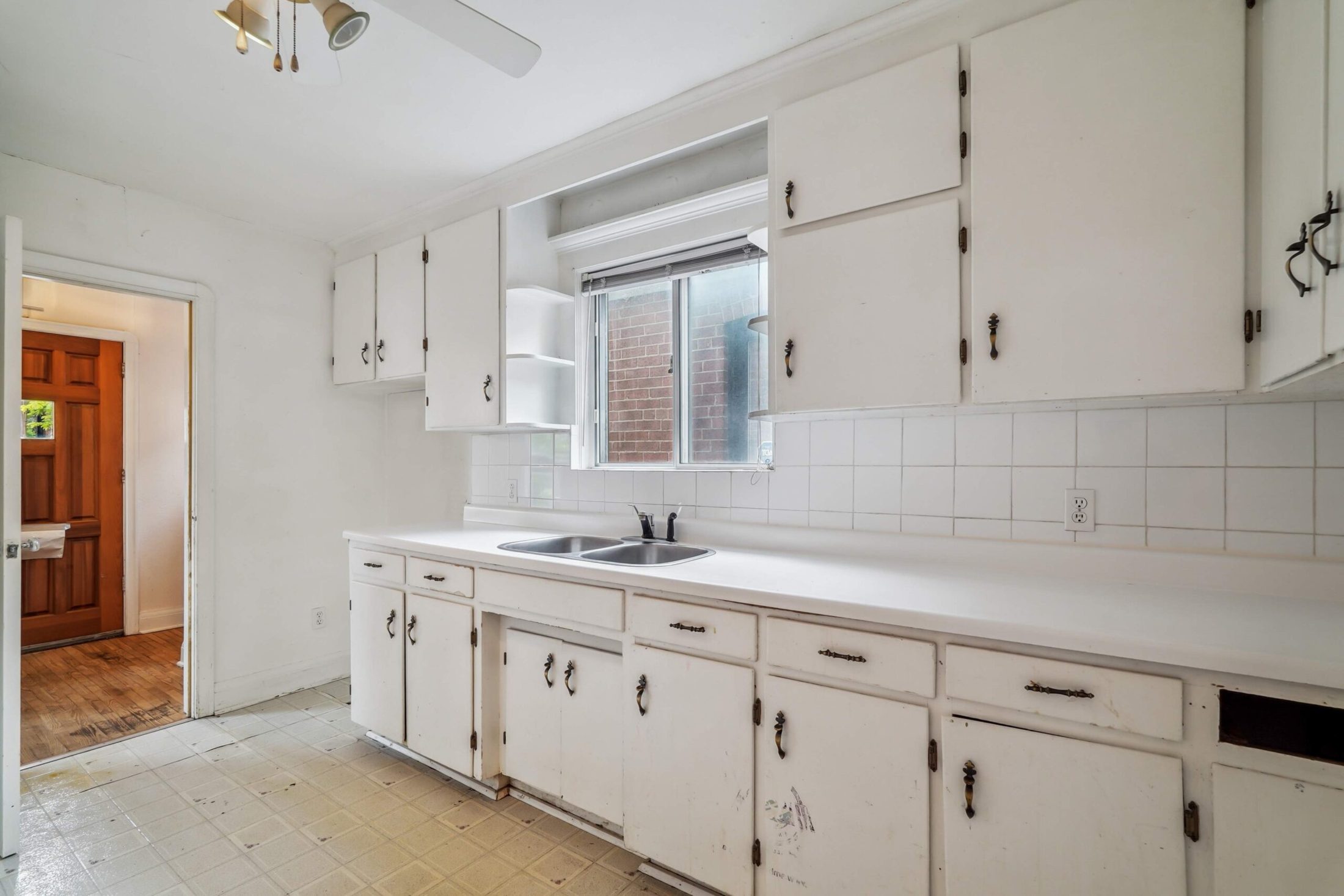 Eat-in kitchen with double sink and window over the counter