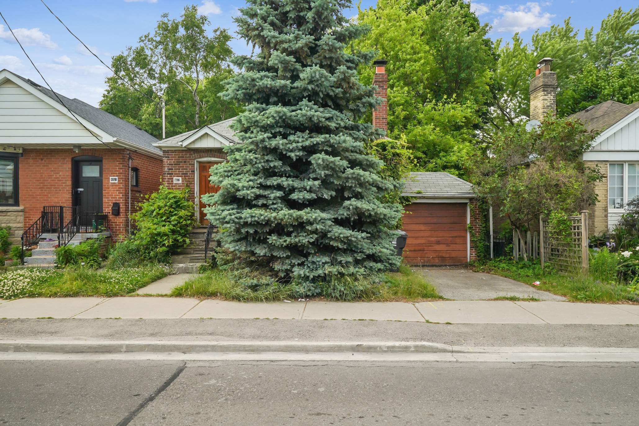 Streetscape view of the home on its quiet Bedford Park block