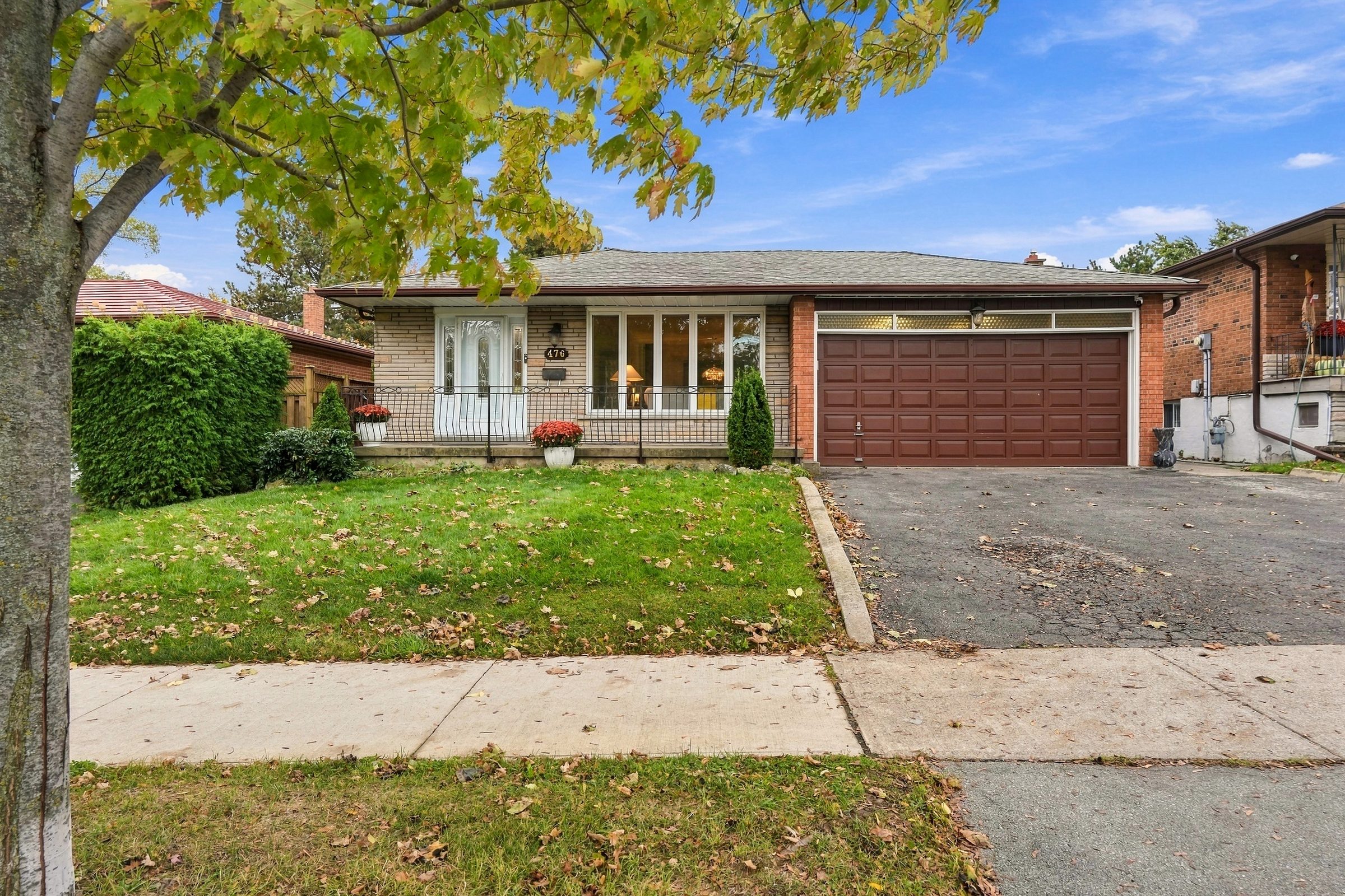 Front exterior and double garage at 476 Michelle Row, Mississauga