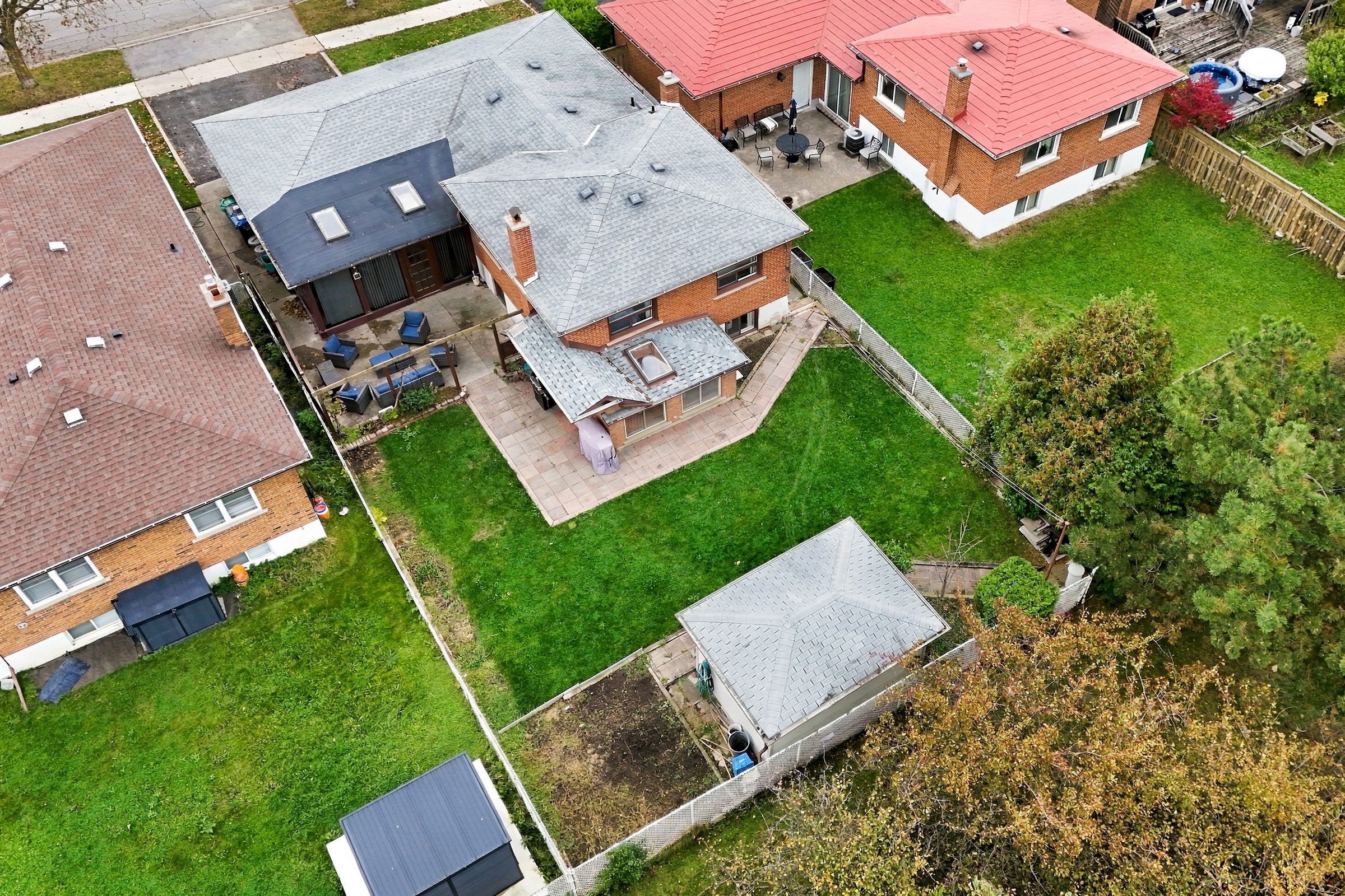Aerial view of the rear yard, patio and sunroom at 476 Michelle Row, Mississauga