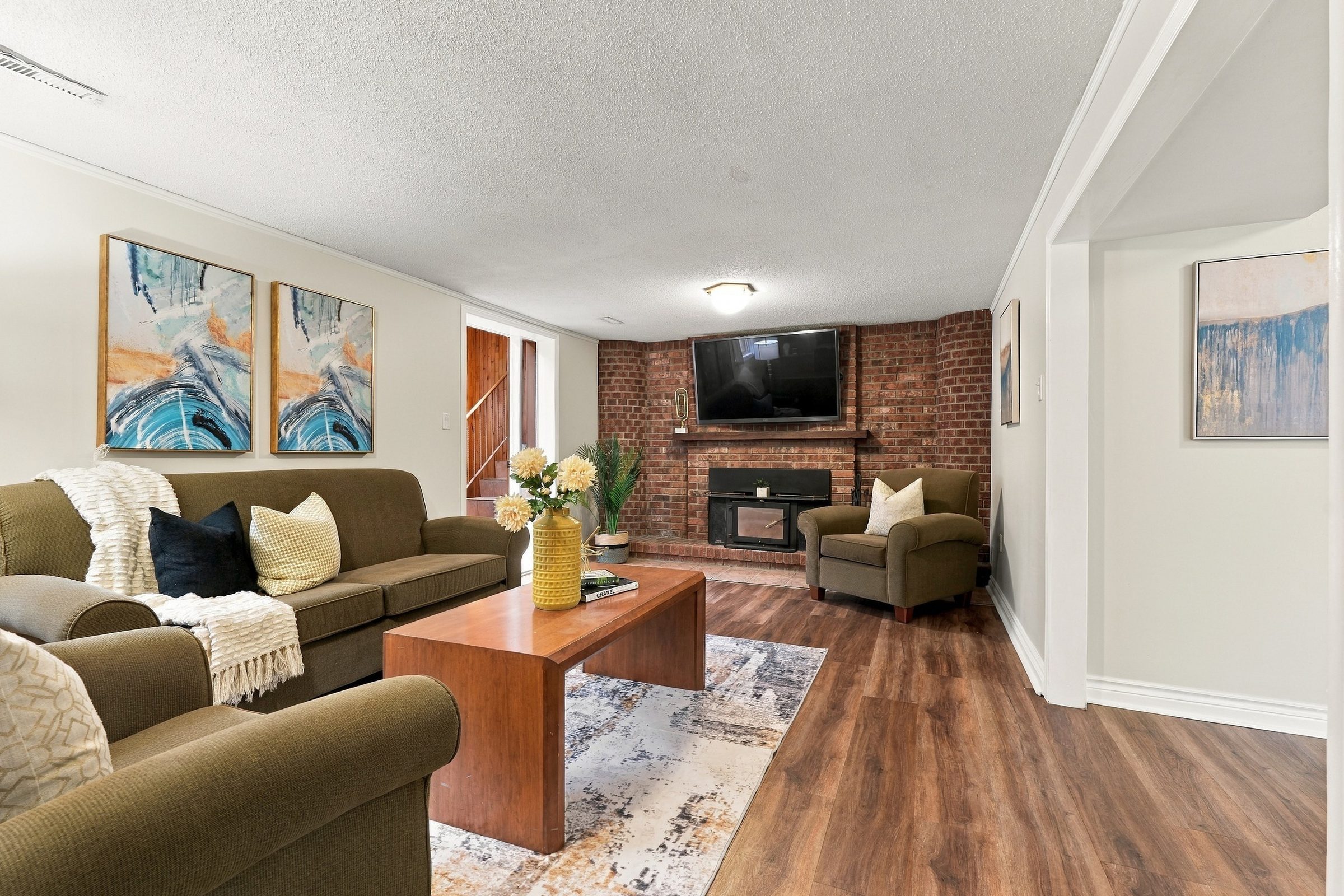 Family room with wood-burning fireplace at 476 Michelle Row, Mississauga