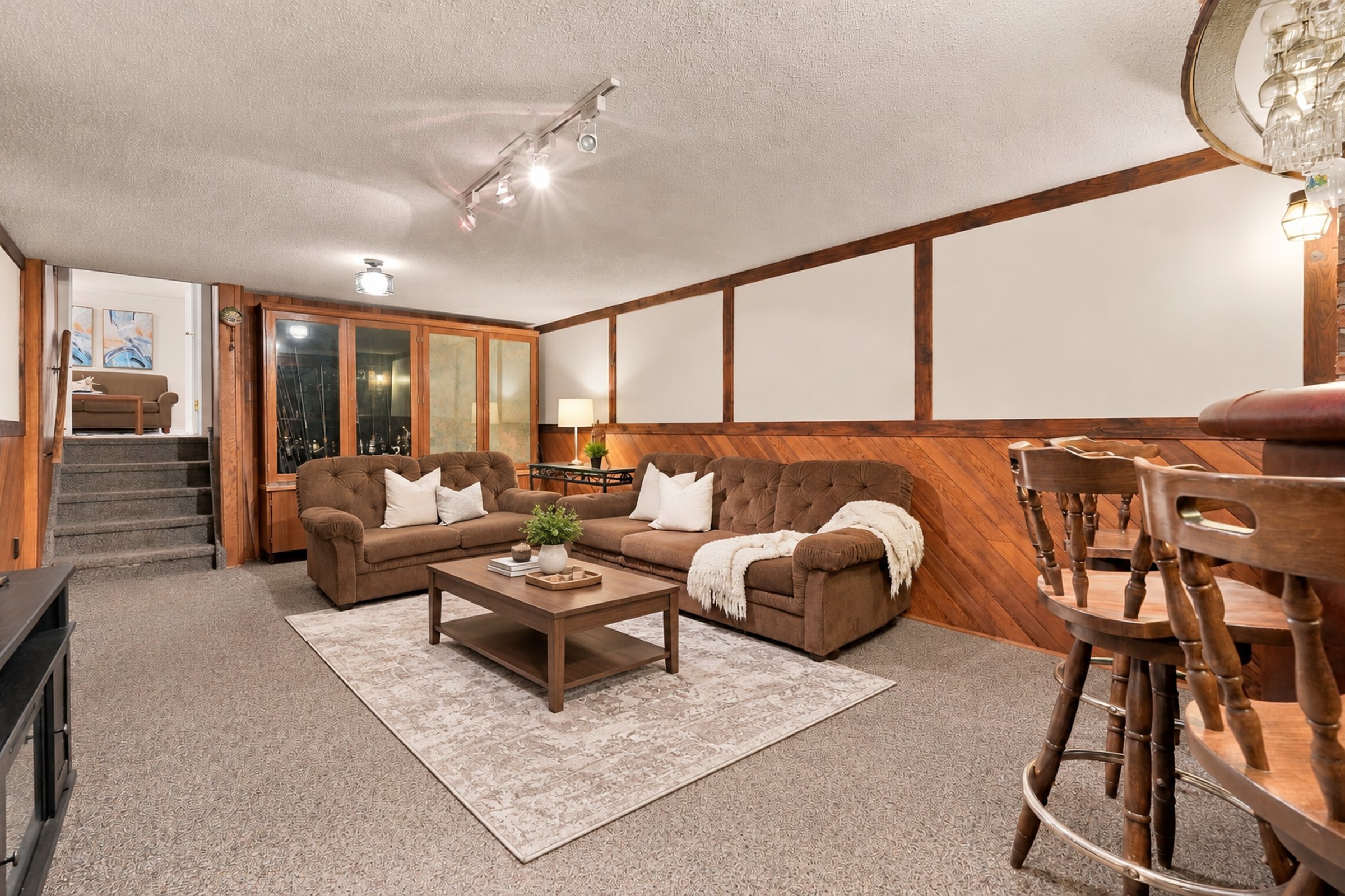 Lower-level recreation room looking toward the stairs at 476 Michelle Row, Mississauga