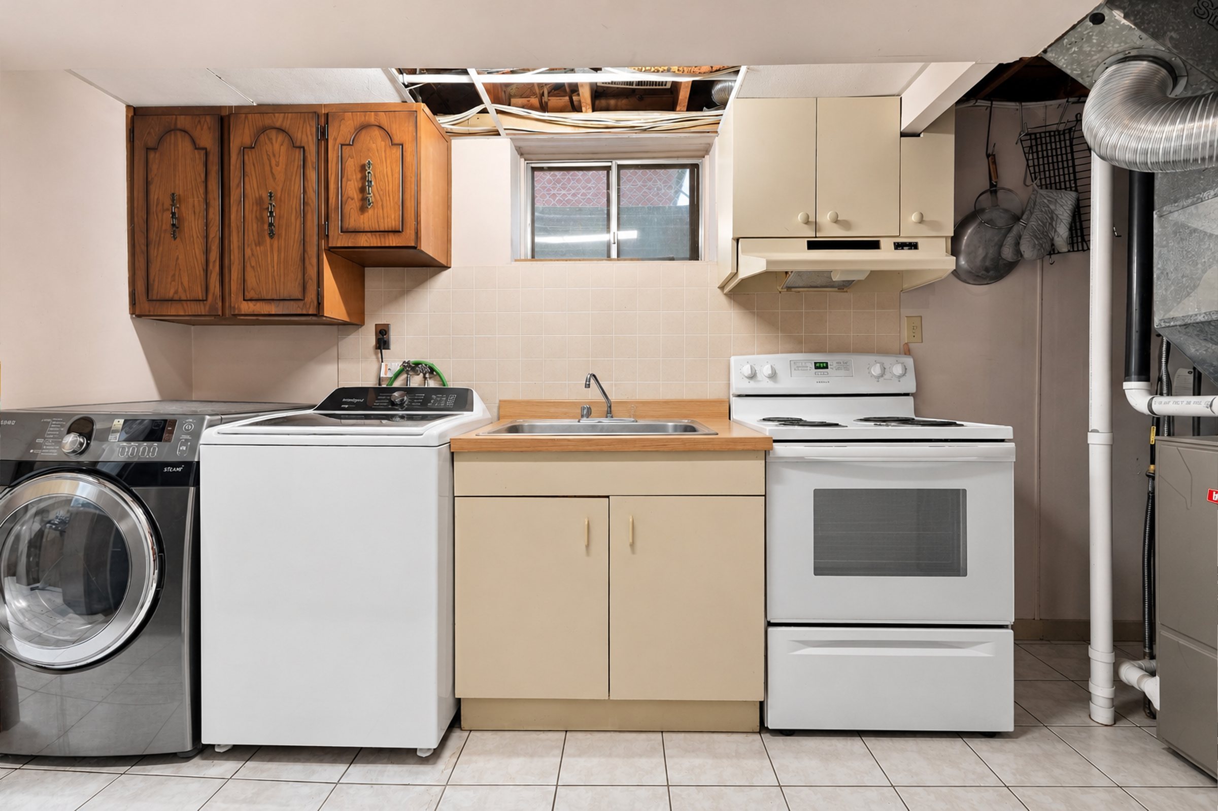 Lower-level laundry and kitchenette at 476 Michelle Row, Mississauga
