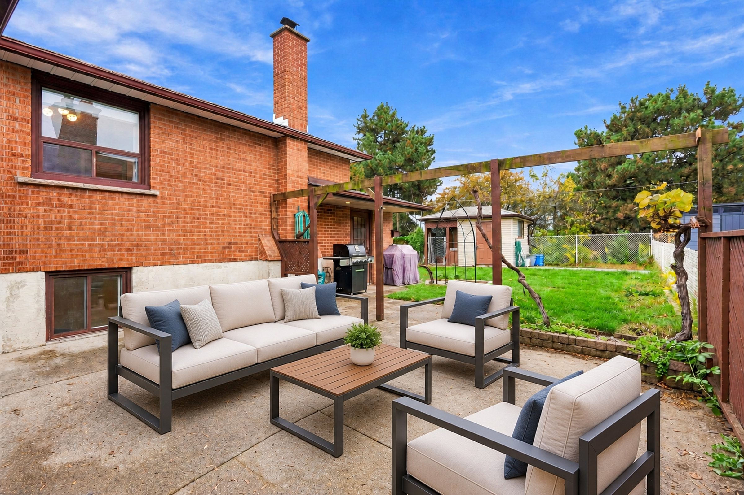 Outdoor patio under the pergola at 476 Michelle Row, Mississauga (virtually staged)