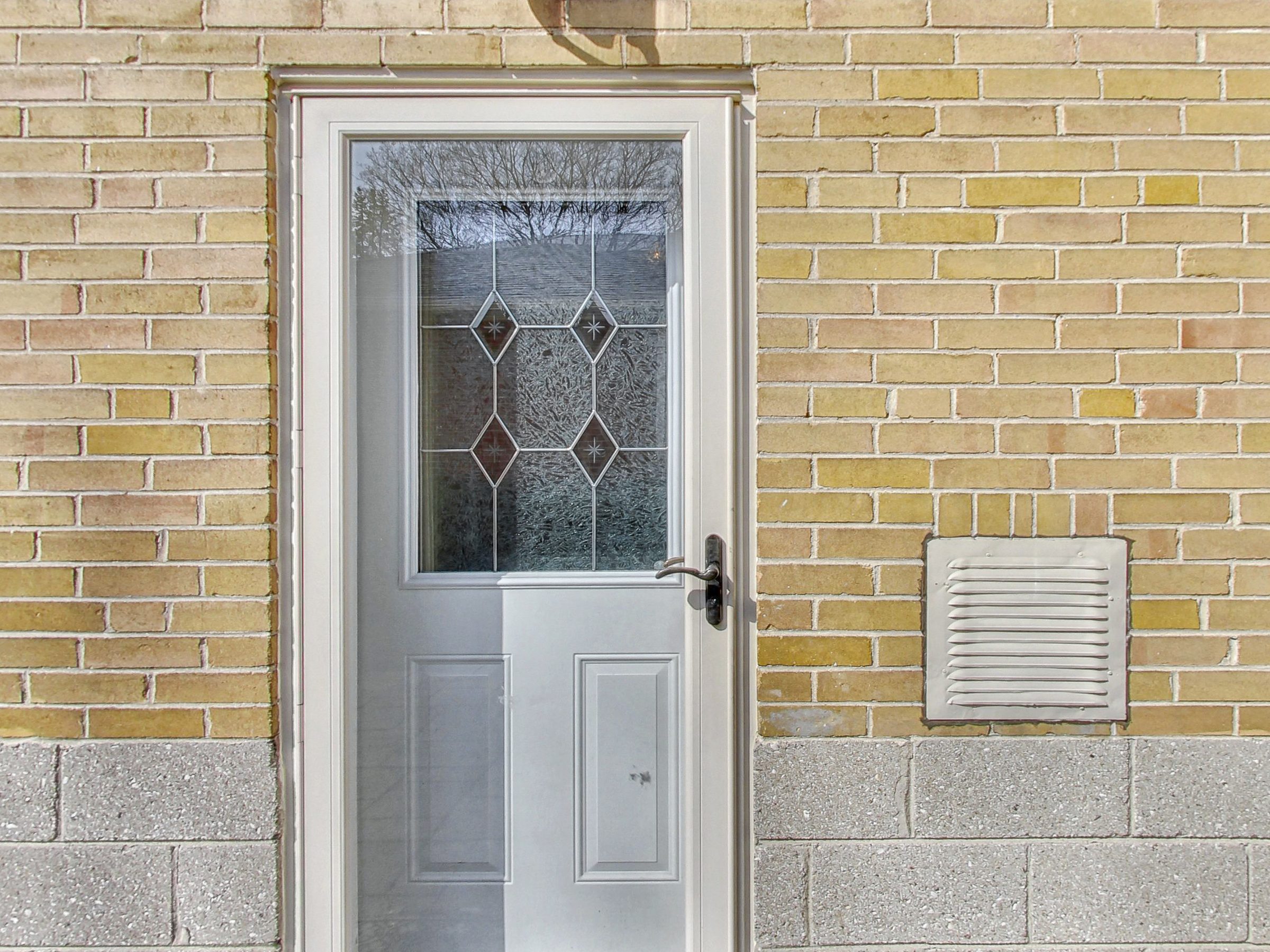 Rear entrance door with leaded glass at 51 Norseman Street, Toronto