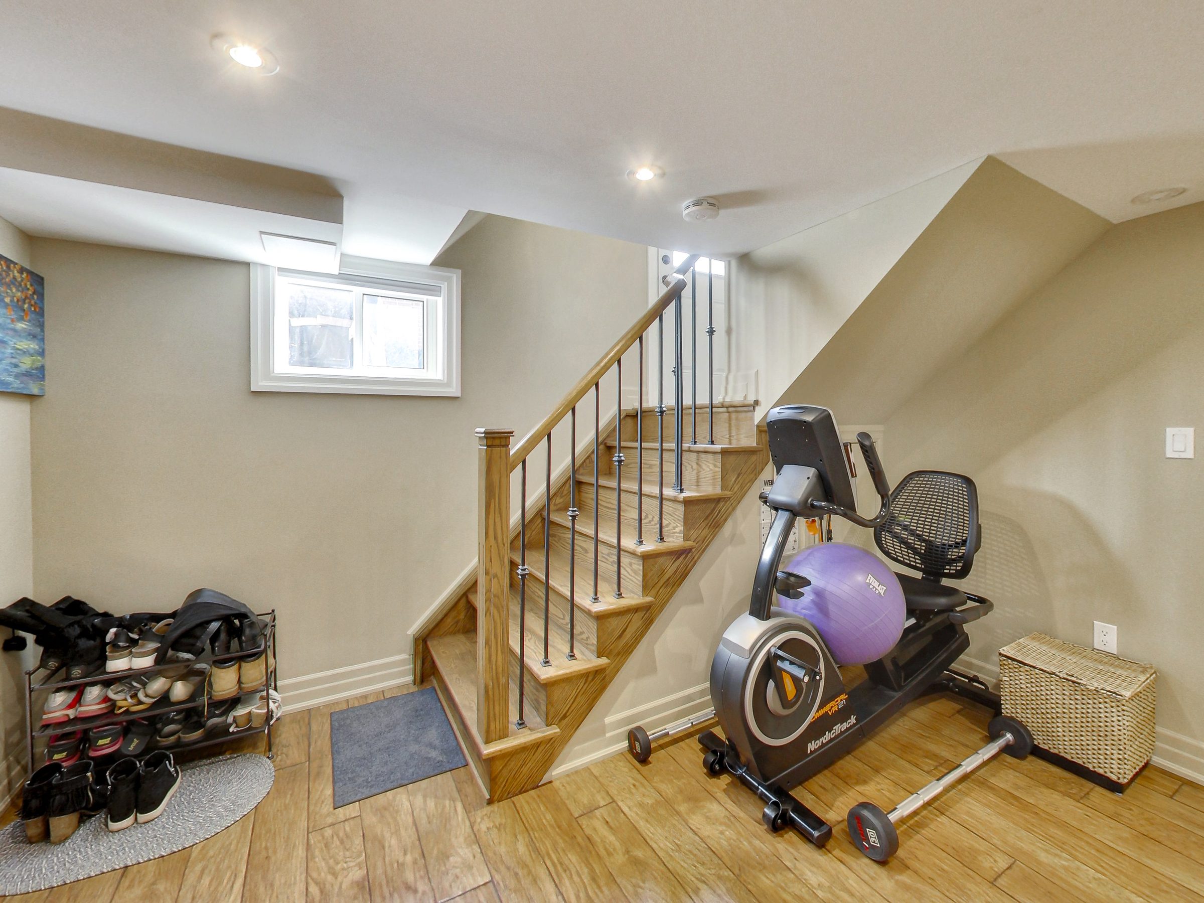Bright foyer and stairs in the lower suite at 51 Norseman Street, Toronto
