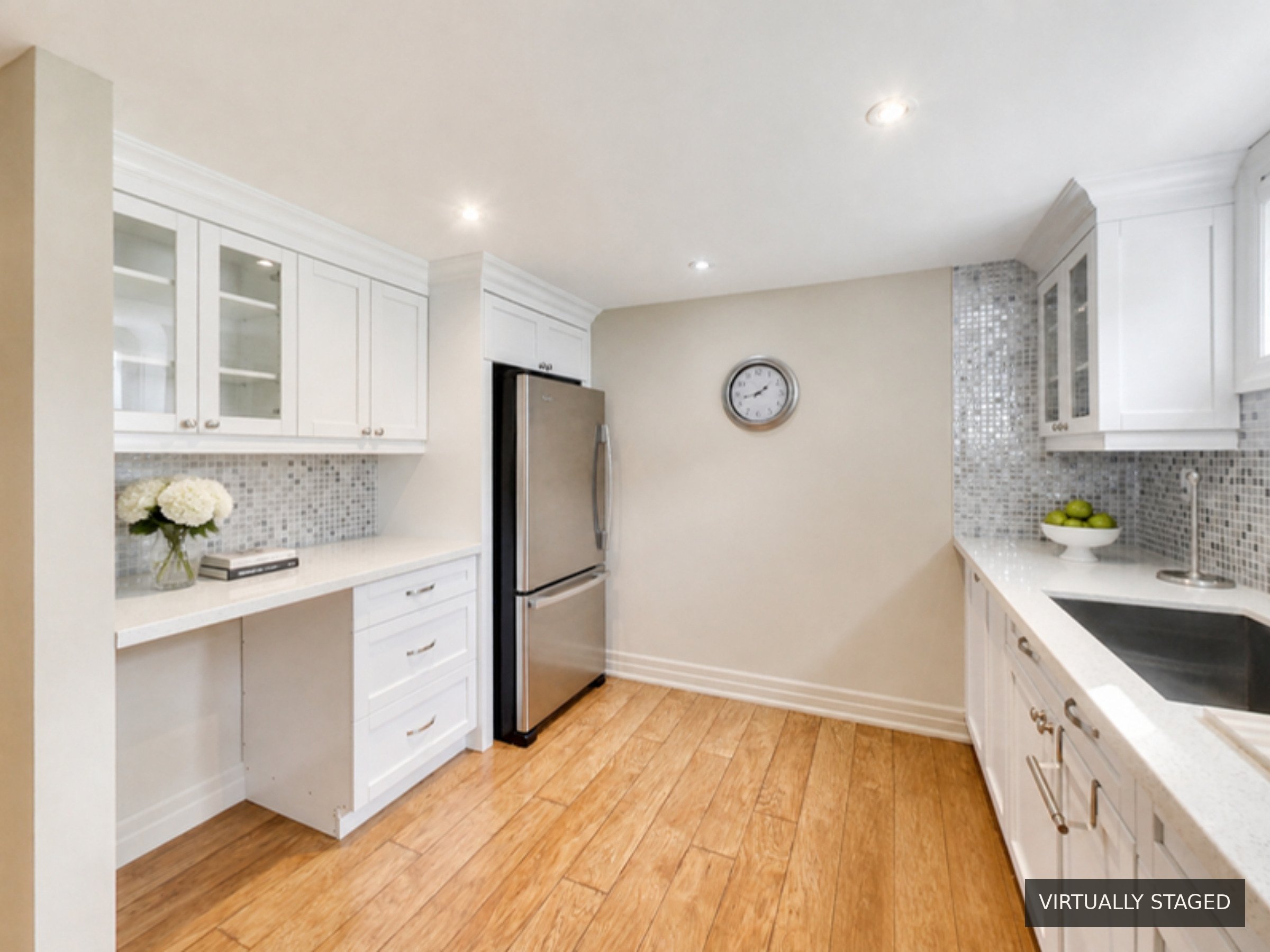 Kitchen desk and fridge, virtually staged, at 51 Norseman Street, Toronto