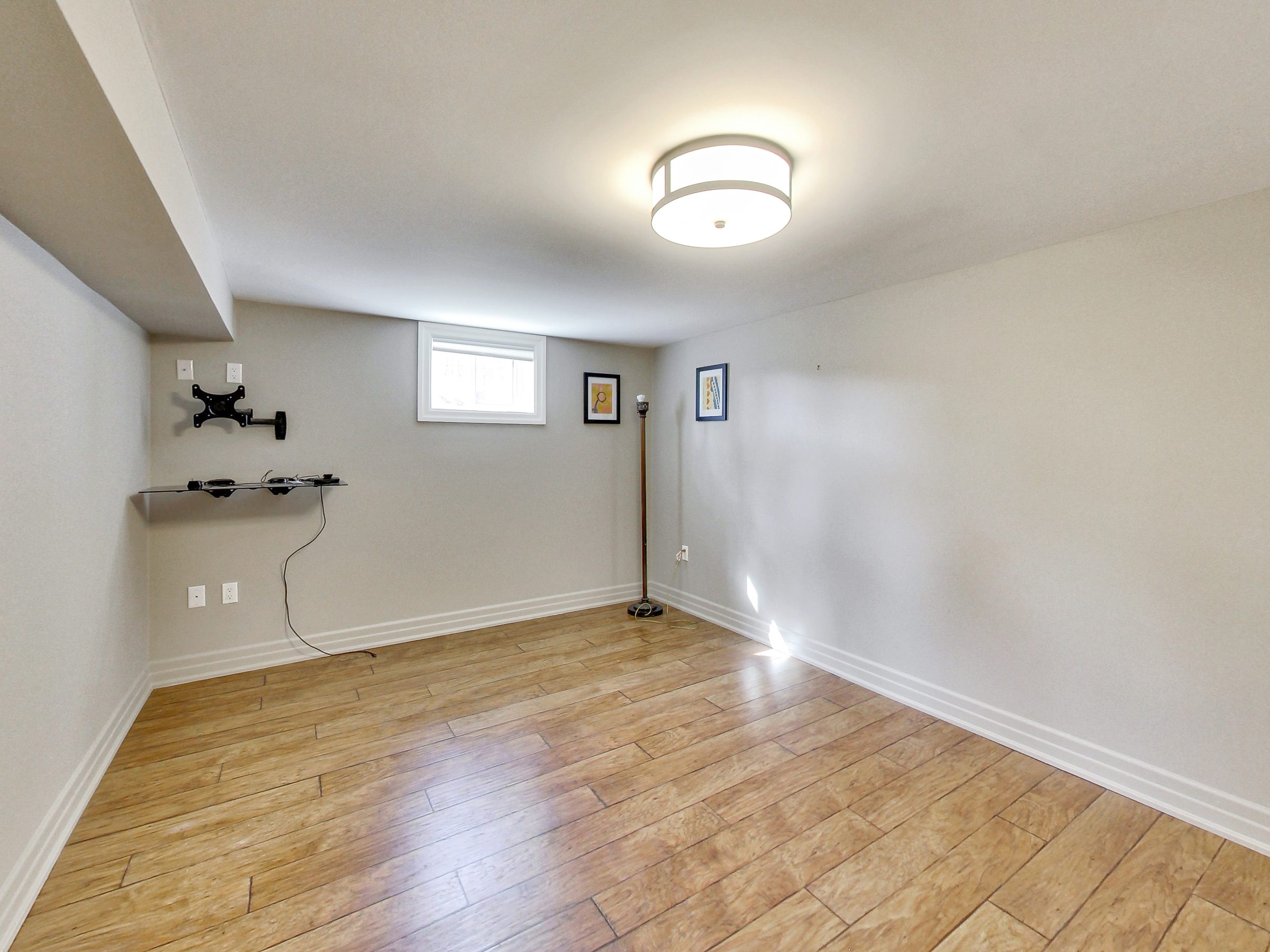 Bedroom in the lower suite at 51 Norseman Street, Toronto