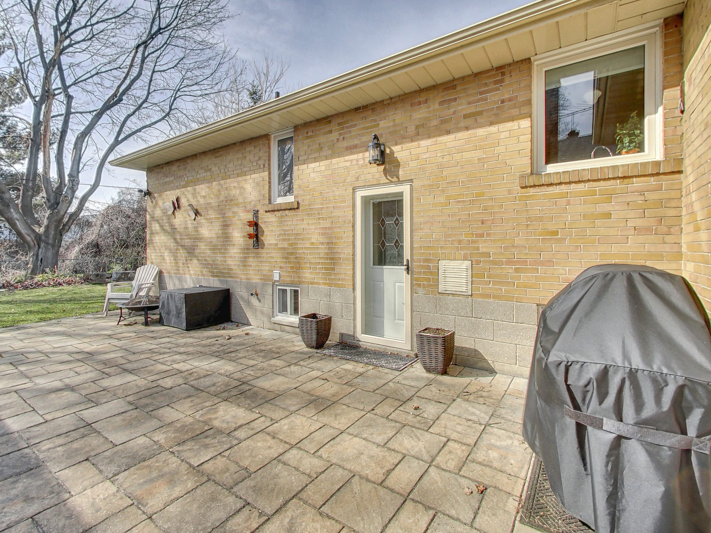 Rear exterior of the home at 51 Norseman Street, Toronto
