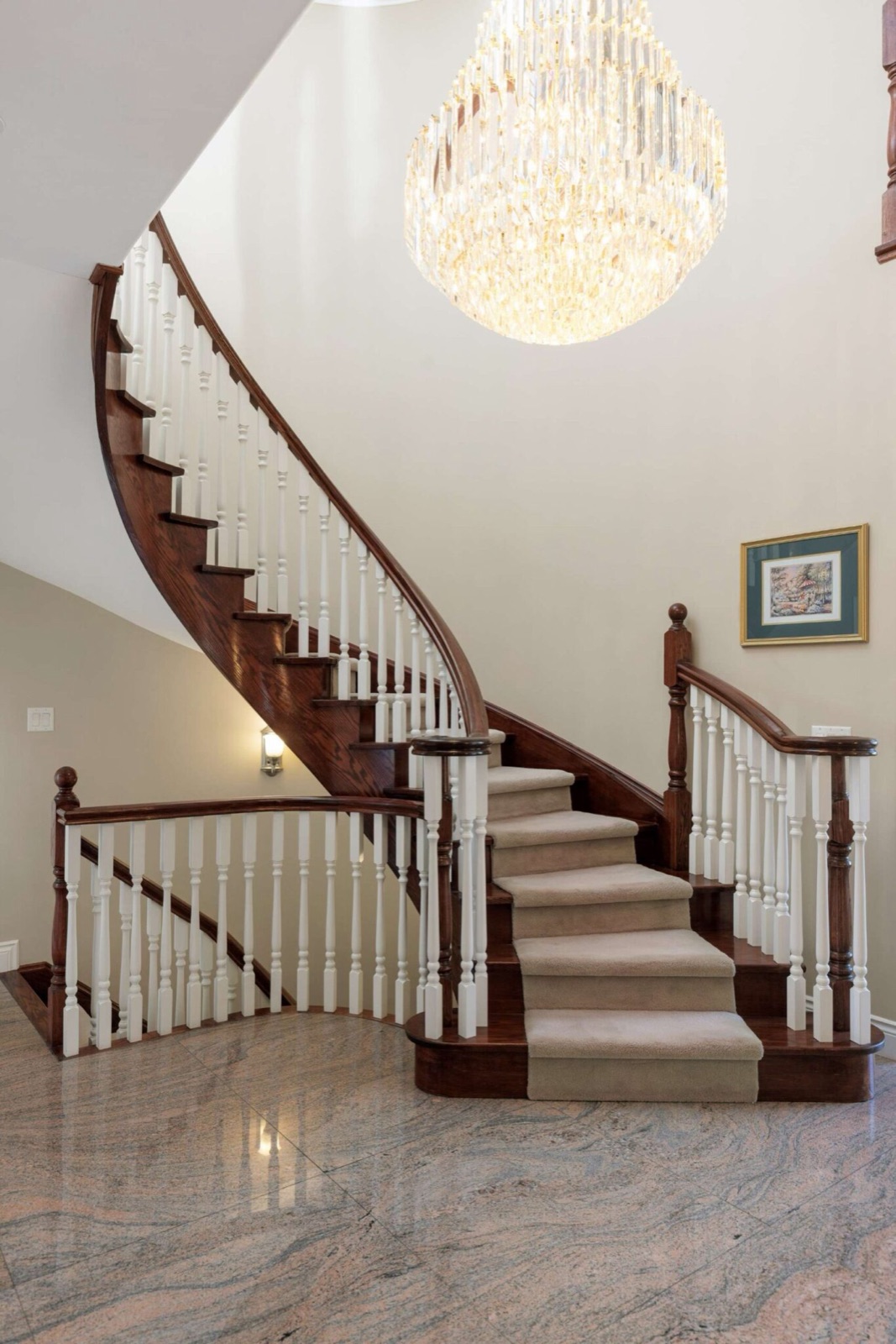 Grand foyer with circular oak staircase