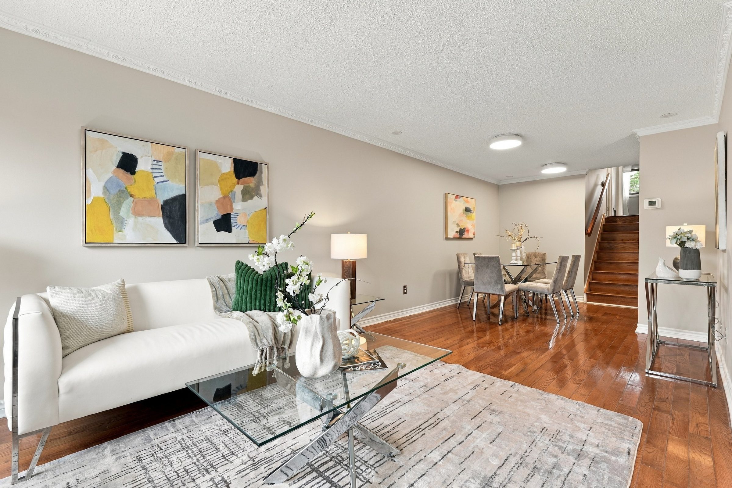 Living room opening to the dining area at 7179 Delmonte Crescent