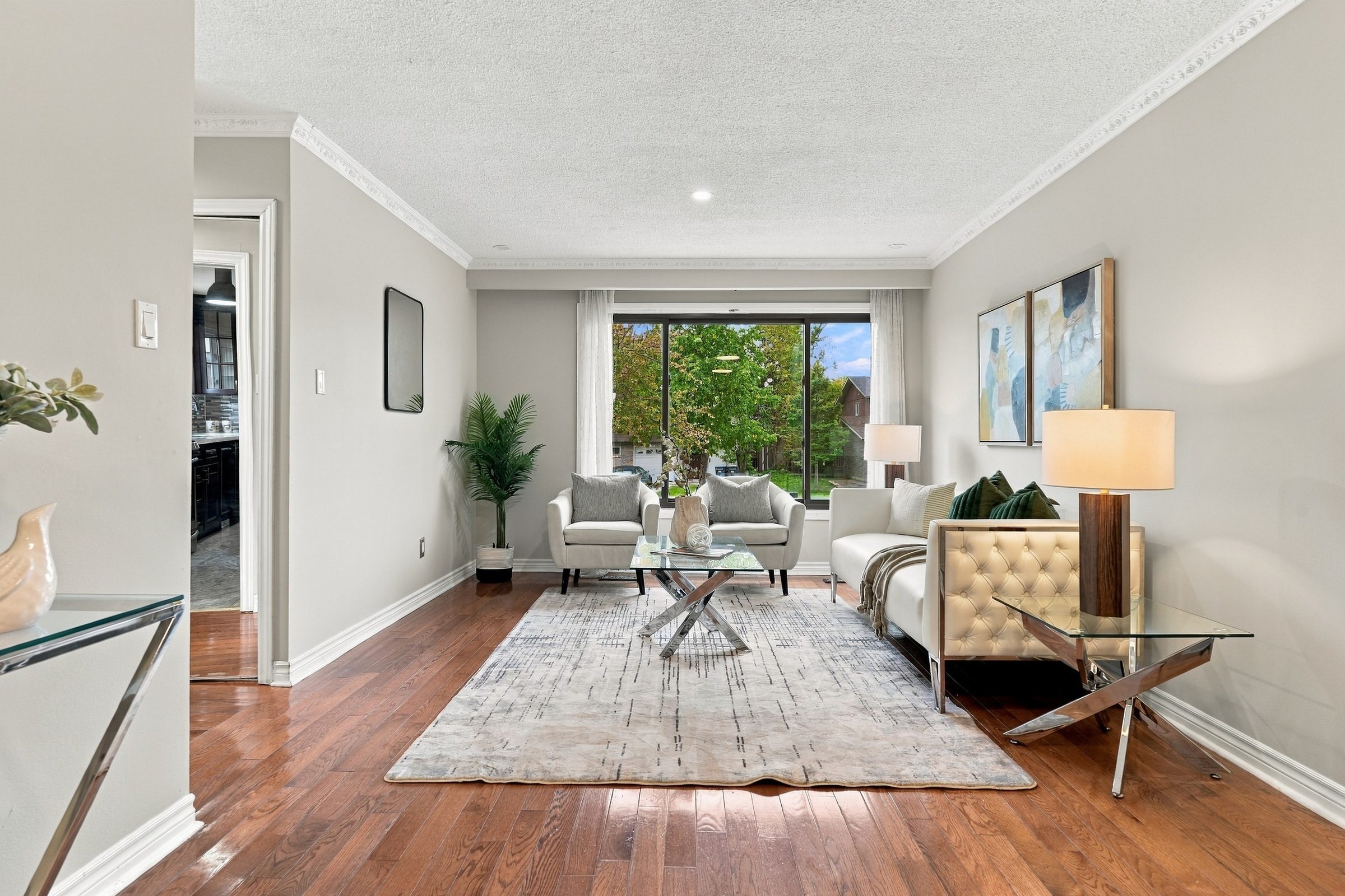 Living and dining space with hardwood floors at 7179 Delmonte Crescent