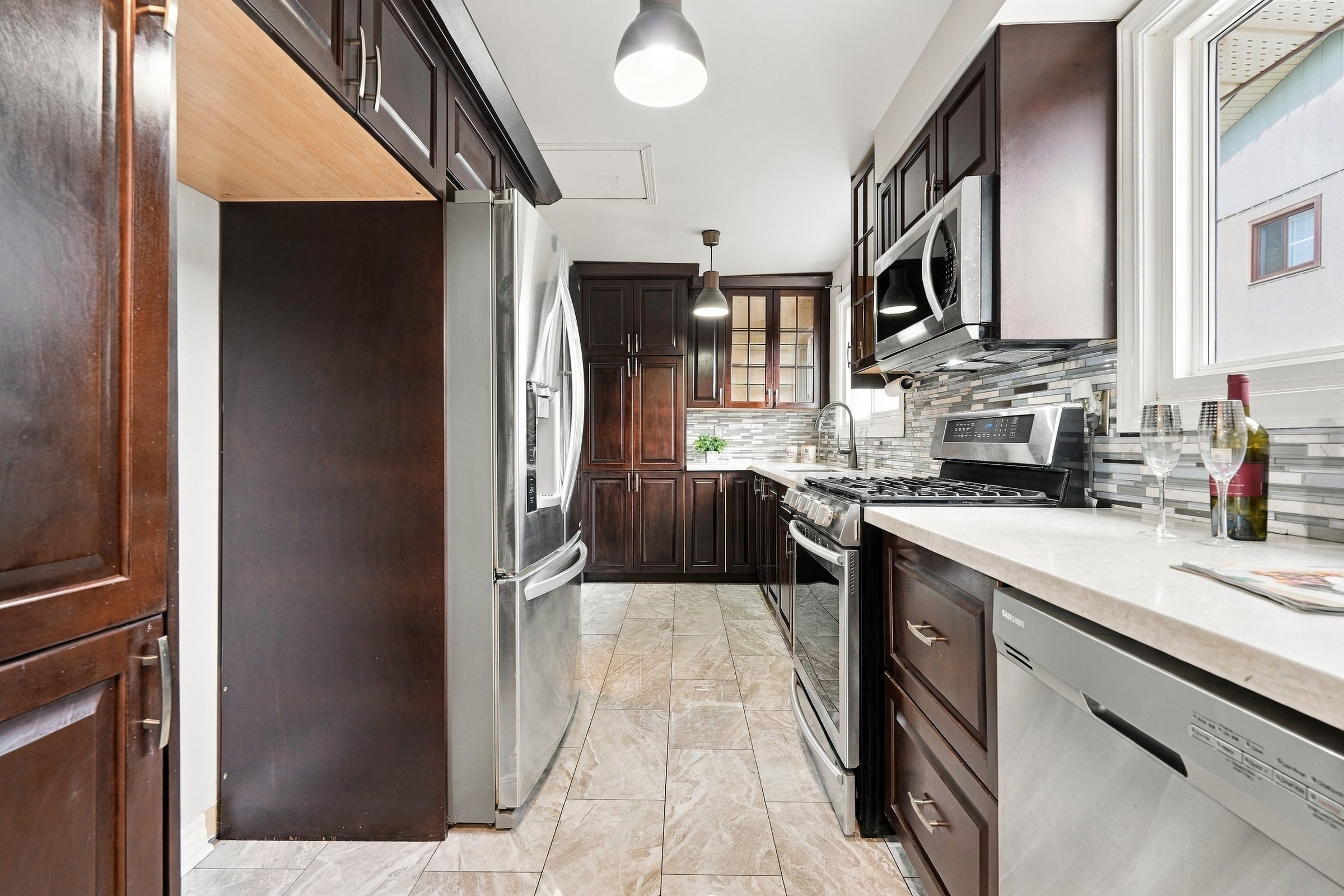Kitchen with stainless appliances at 7179 Delmonte Crescent