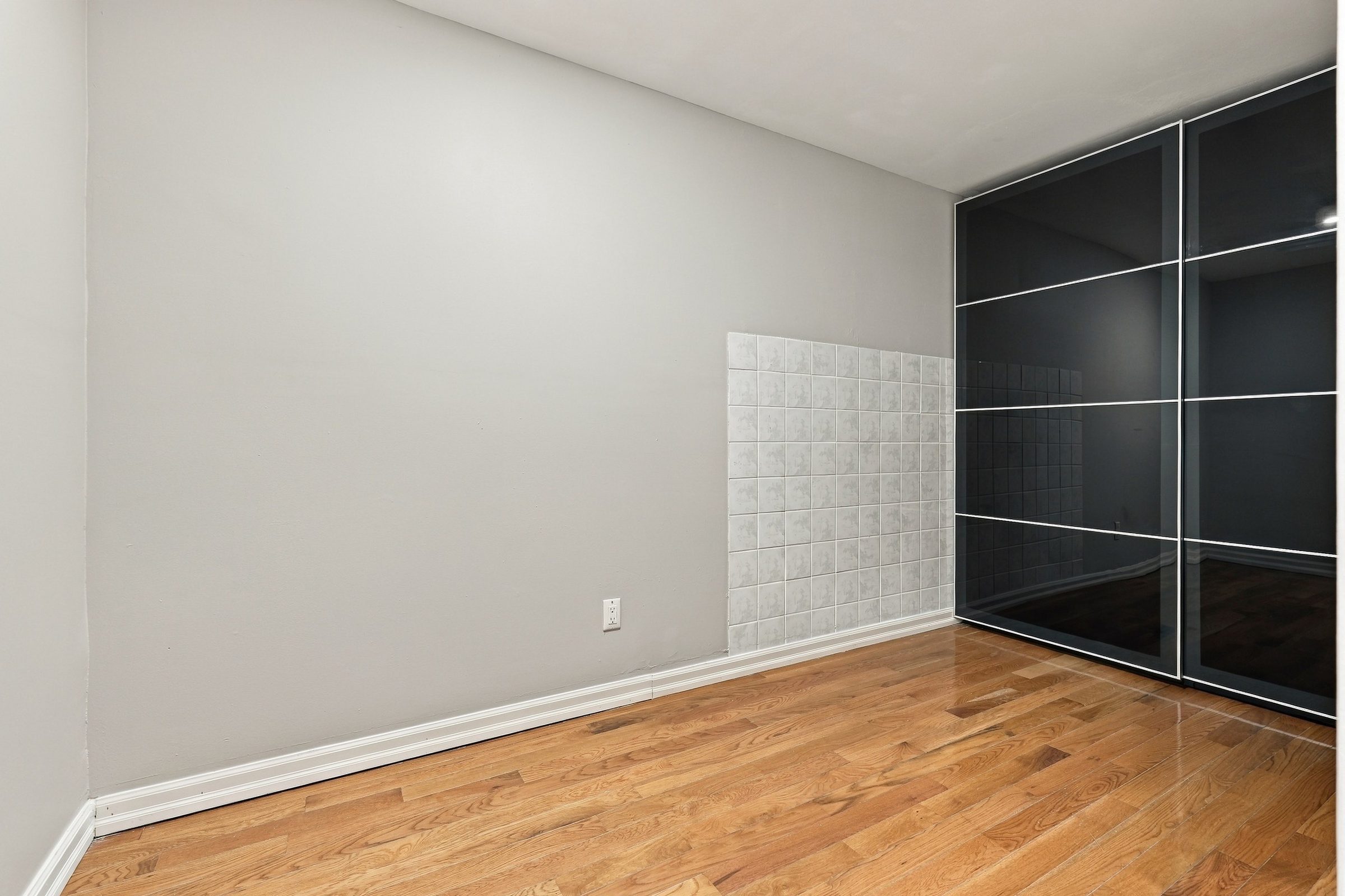 Bedroom with sliding-door wardrobe at 7179 Delmonte Crescent