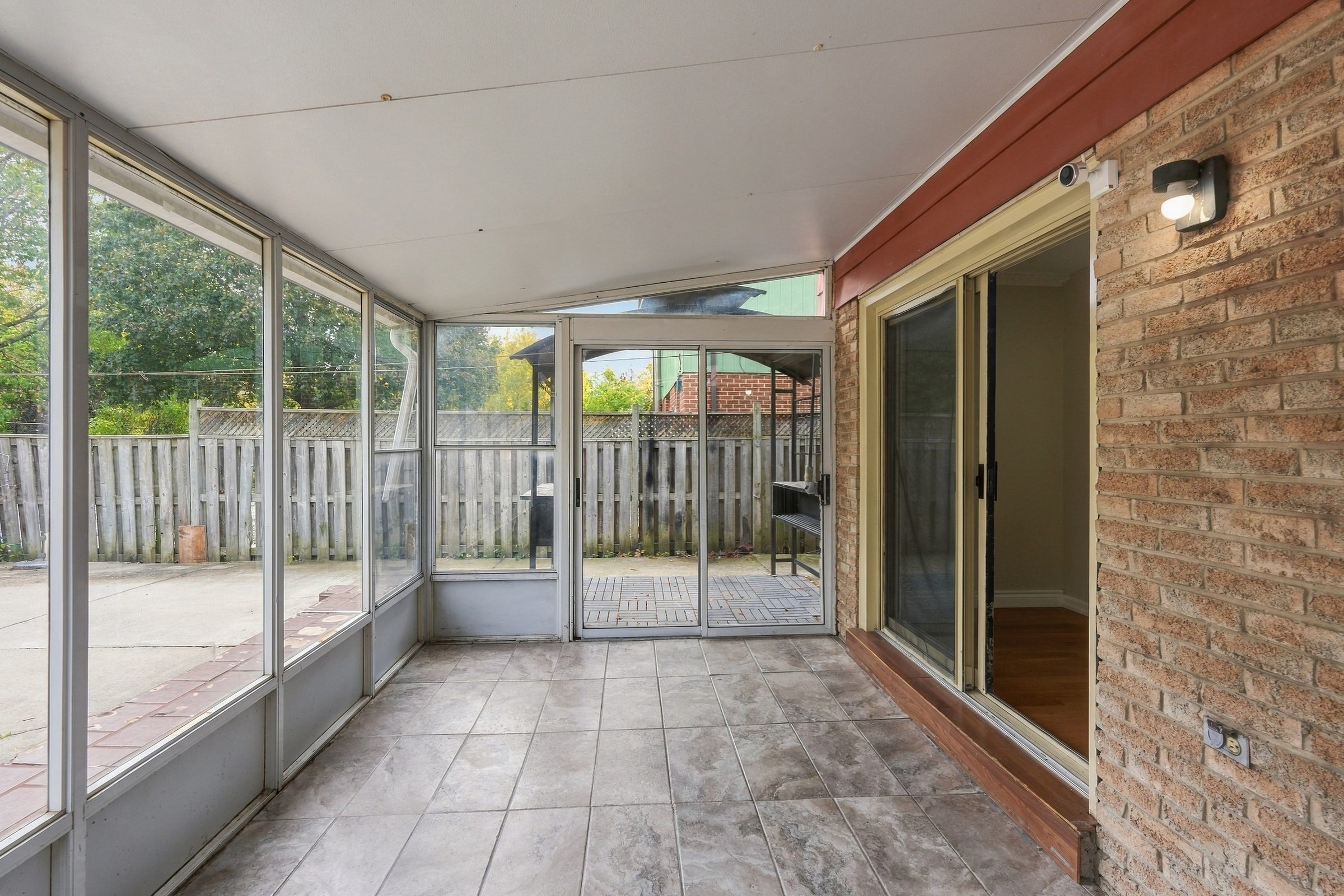 Sunroom looking onto the backyard at 7179 Delmonte Crescent
