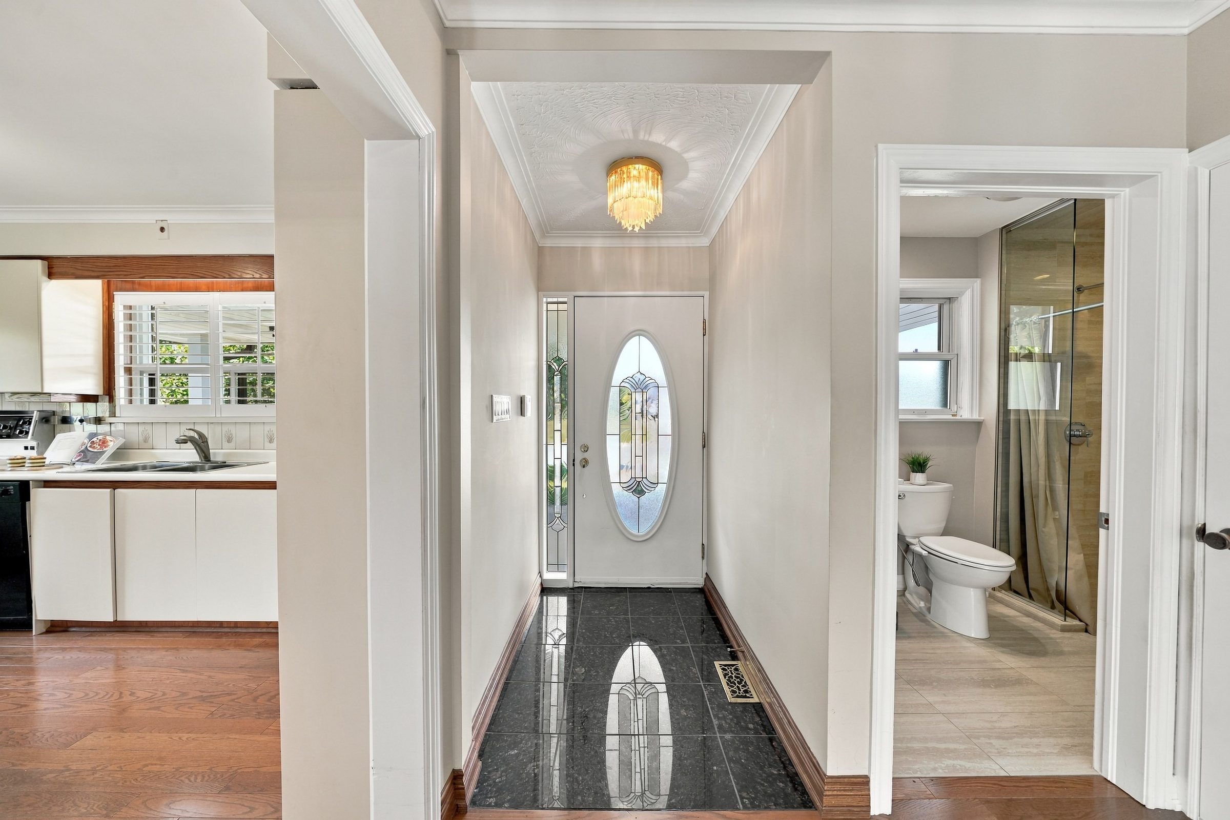 Tiled foyer looking to the front door