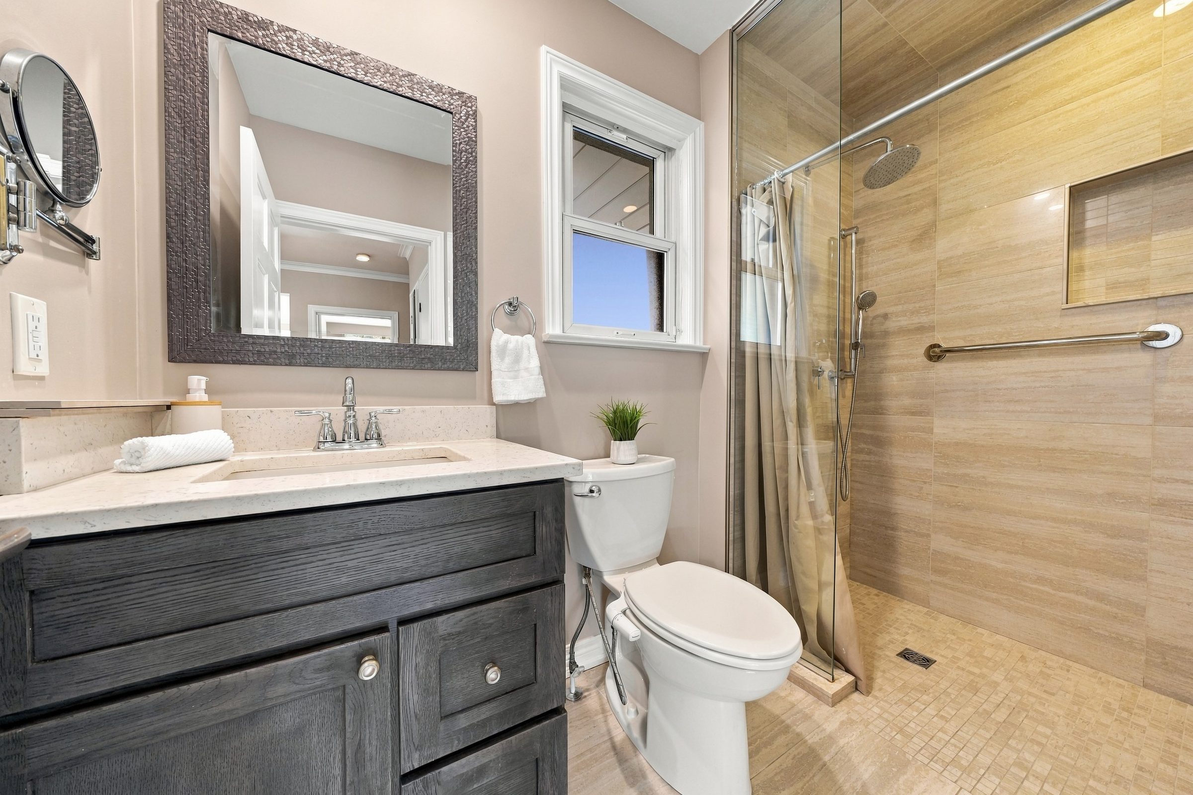 Renovated full bathroom with glass shower